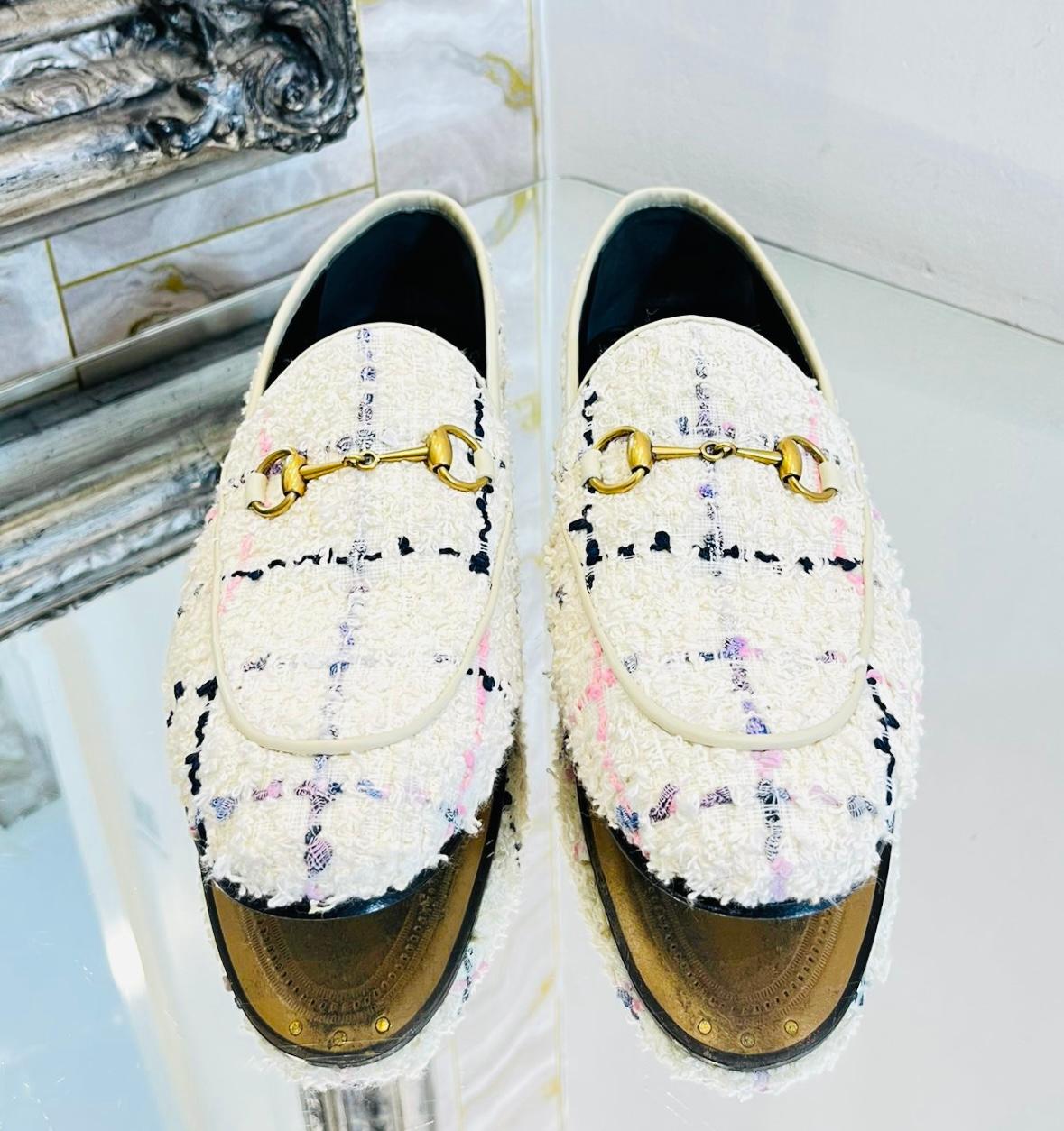 Gucci Jordaan Tweed Loafers

Ivory flats designed with pastel blue and pink stitching details.

Featuring the brand's signature gold Horsebit buckle to the front.

Slip-on style with short, block heel; leather lining and insoles. Rrp £690

Size –