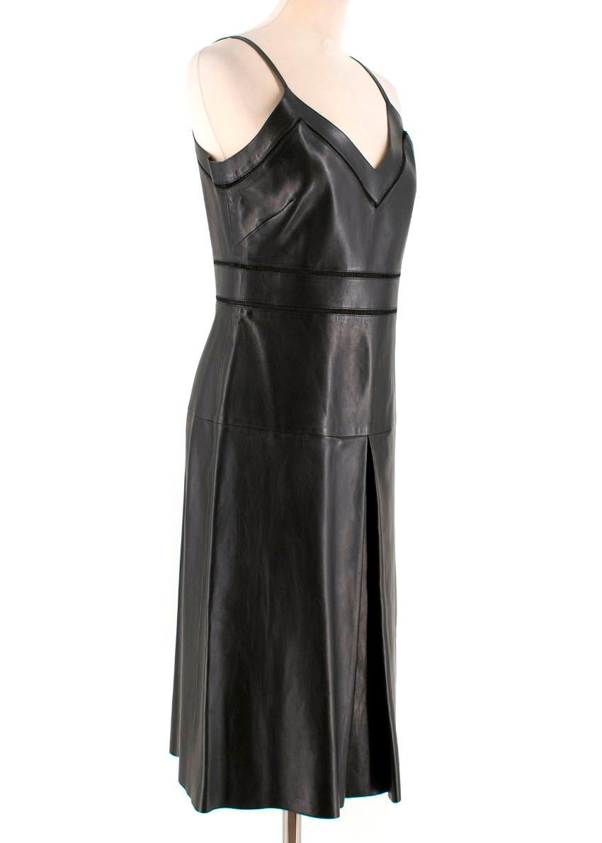 Gucci jour echelle black leather dress

- Black, smooth leather 
- V-neck, slim shoulder straps
- Black jour echelle trimmed neckline and waist 
- A-line shape, front inverted box pleat 
- Centre-back zip fastening 

Please note, these items are