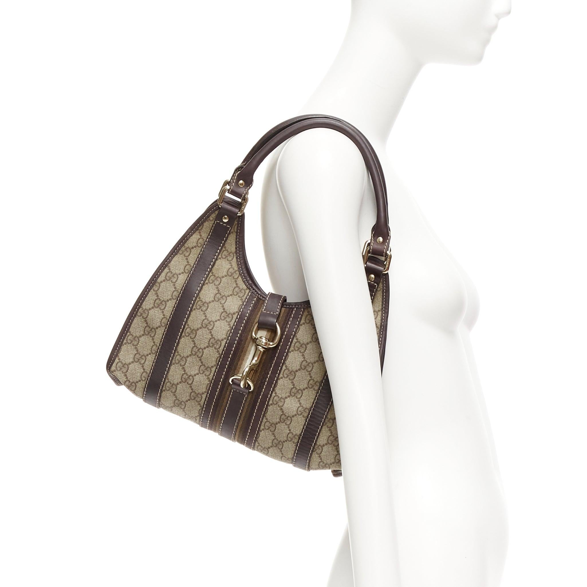 GUCCI Joy Hobo brown Supreme GG monogram gold horsebit clasp shoulder bag
Reference: TGAS/D01099
Brand: Gucci
Model: Joy
Material: Canvas, Leather
Color: Brown, Beige
Pattern: Striped
Closure: Lobster Clasp
Lining: Brown Fabric
Extra Details: Brown