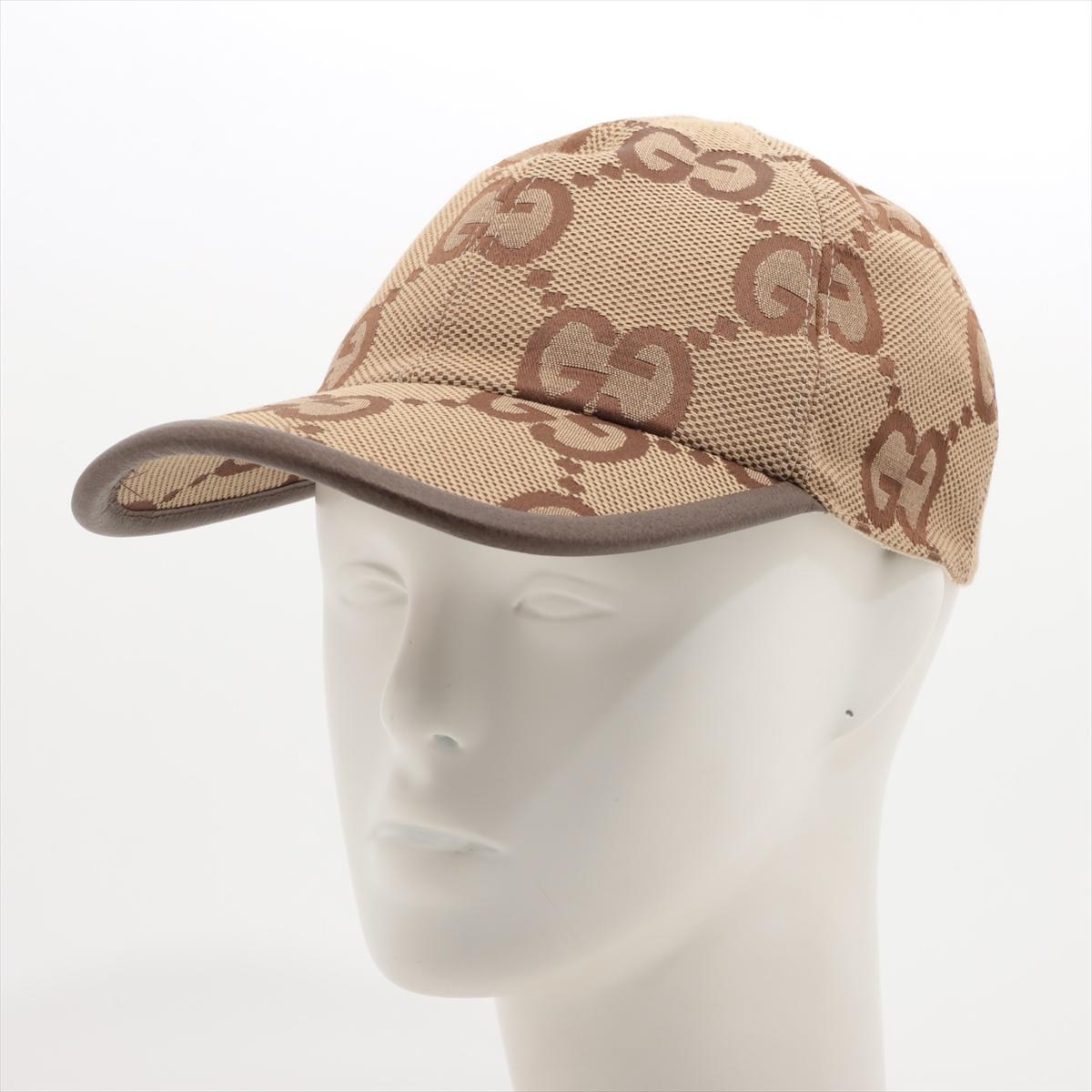 The Gucci Jumbo GG Canvas Baseball Hat in Camel x Ebony is a stylish and iconic accessory that combines luxury with sporty flair. Crafted from durable canvas adorned with Gucci's signature jumbo GG monogram pattern, the baseball hat exudes