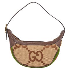Mini borsa Ophidia di Gucci in tela GG e pelle di maiale marrone