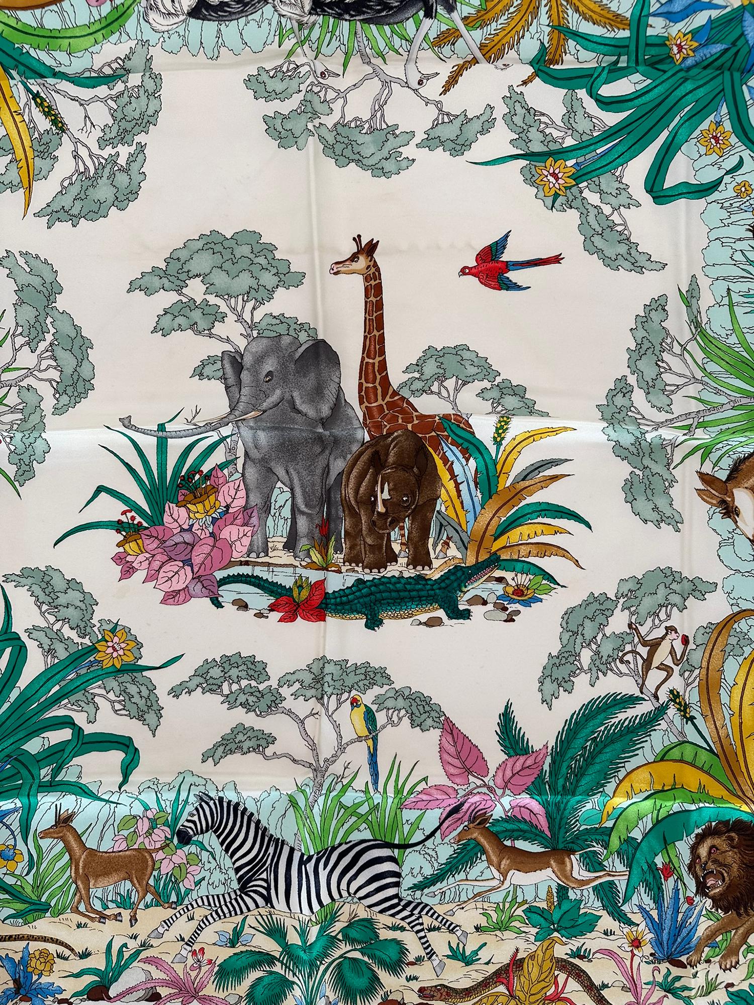 Gucci Jungle Silk Twill Scarf Designed by designed by Vittorio Accornero from the 1970s. This fabulous scarf is famous for it's detailed art work, every inch brilliantly illustrated with the denizens of the jungle. The colours are dramatic every bit