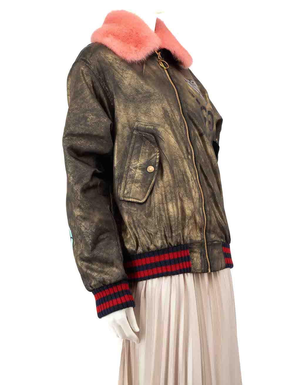 CONDITION is Very good. Hardly any visible wear to the jacket is evident. There are two loops that have snapped which connect the detachable fur to the jacket on this used Gucci designer resale item.
 
 
 
 Details
 
 
 Khaki with gold metallic