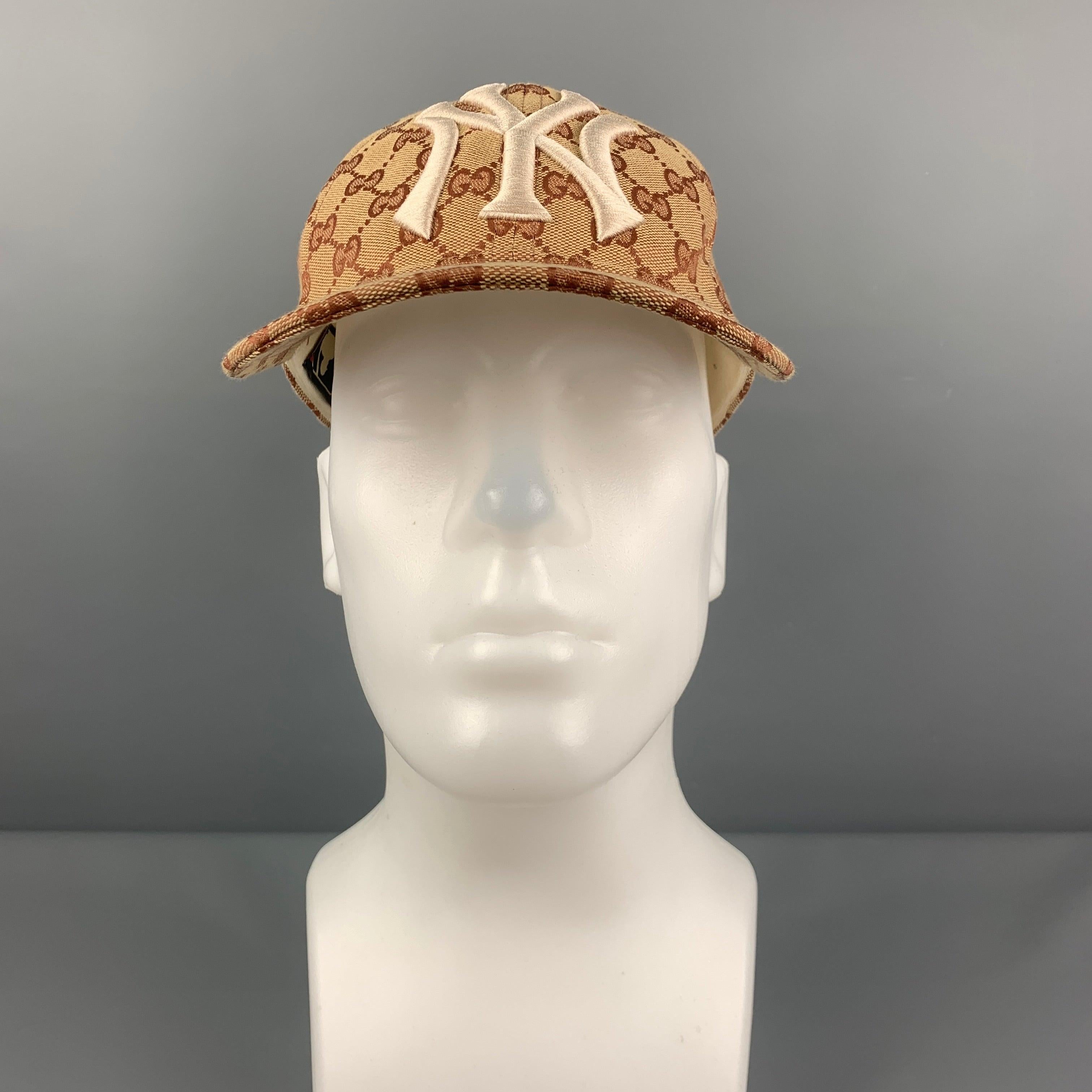GUCCI cap comes in a khaki & tan 'GG' monogram print canvas featuring a embroidered NY Yankees logo and a adjustable back strap closure. Comes with dust bag. Made in Italy.
 Very Good
 Pre-Owned Condition. Moderate discoloration at interior.  
 

