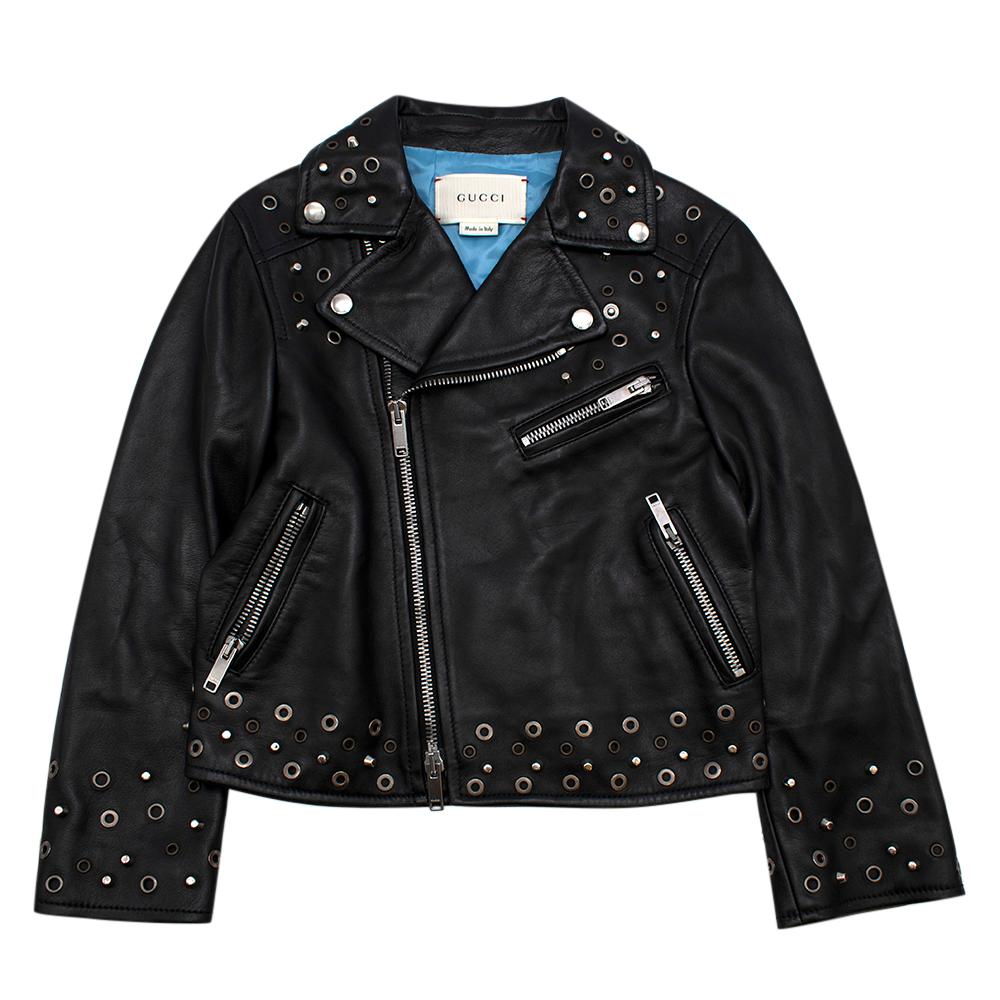 Gucci Kids Black Embroidered Leather Biker Jacket 

- Contrast Blue Lining 
- Lapel Collar
- Lion and Slogan Embroidery to back 
- Front Zip Closure
- Eyelet and Stud Detailing 
- Zip Detail at Cuffs
- Silver Toned Hardware 

Material:
- 100% Lamb