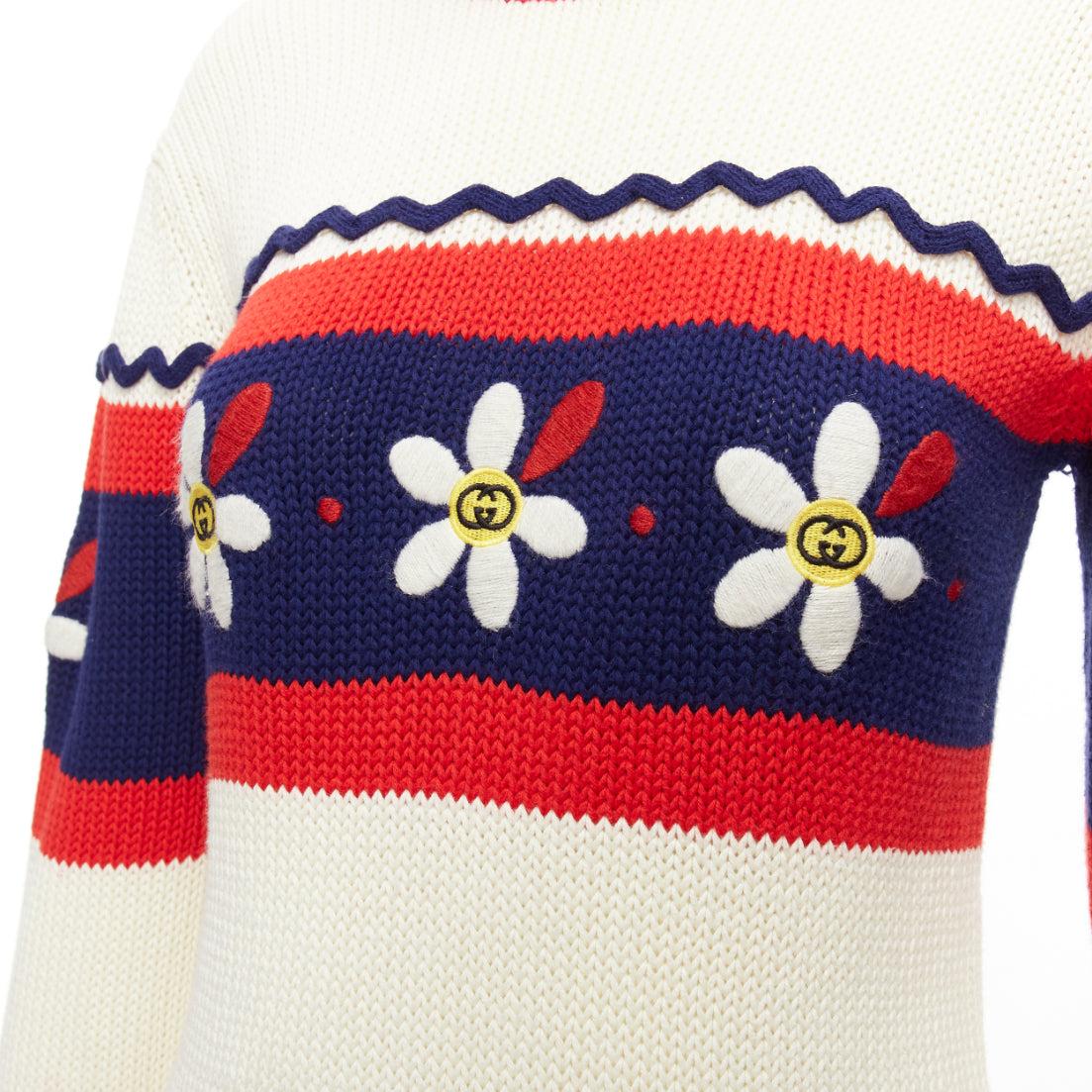 GUCCI Kids cream blue red cotton GG logo daisy bateau sweater I2Y XS
Reference: KYCG/A00011
Brand: Gucci
Collection: Kids
Material: Cotton
Color: Cream, Red
Pattern: Logomania
Closure: Button
Extra Details: Shoulder button closure.
Made in: