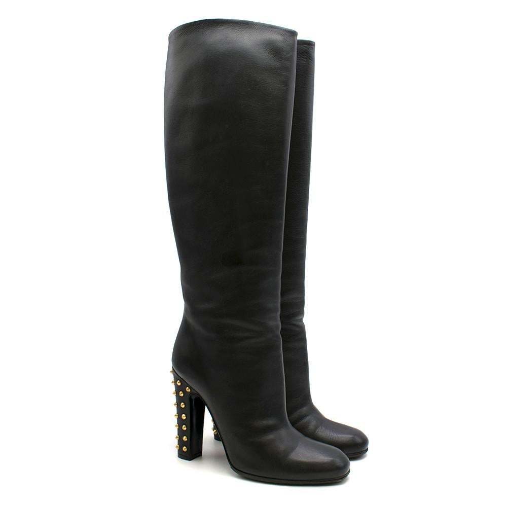 Gucci Black Leather Chunky heel boots

- Gold stud detailing on the heel

- Sheer finish to the leather

- Rubber sole for grip 

- Round/pointy mix toe finish


