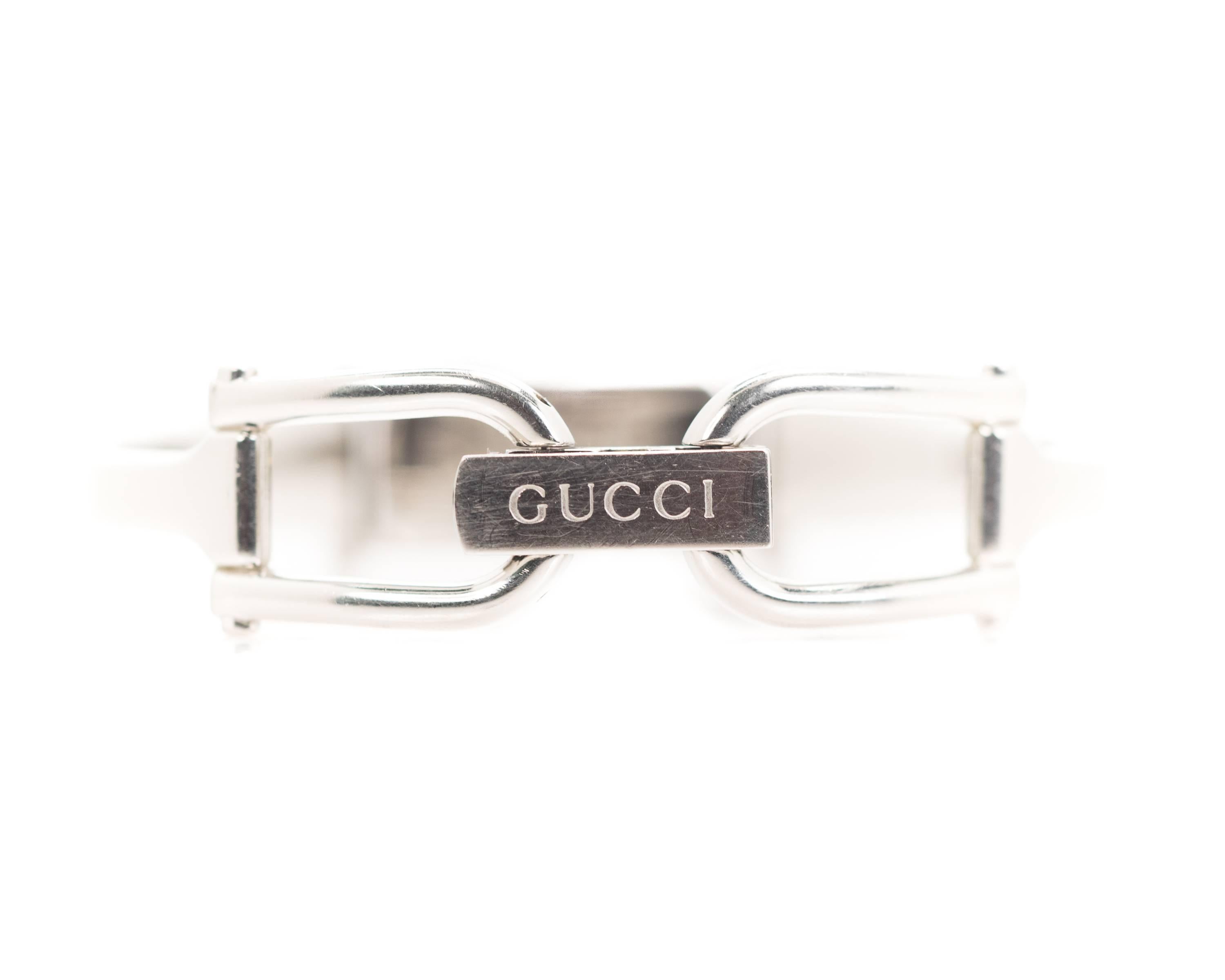 Gucci Ladies Wrist Watch - Stainless Steel

Features Gucci's Signature Horsebit design clasp, a Silvered Dial and Stainless Steel Case & Bracelet. 
This classic Designer watch doubles as a bangle and a wrist watch. The clean, simple design makes it