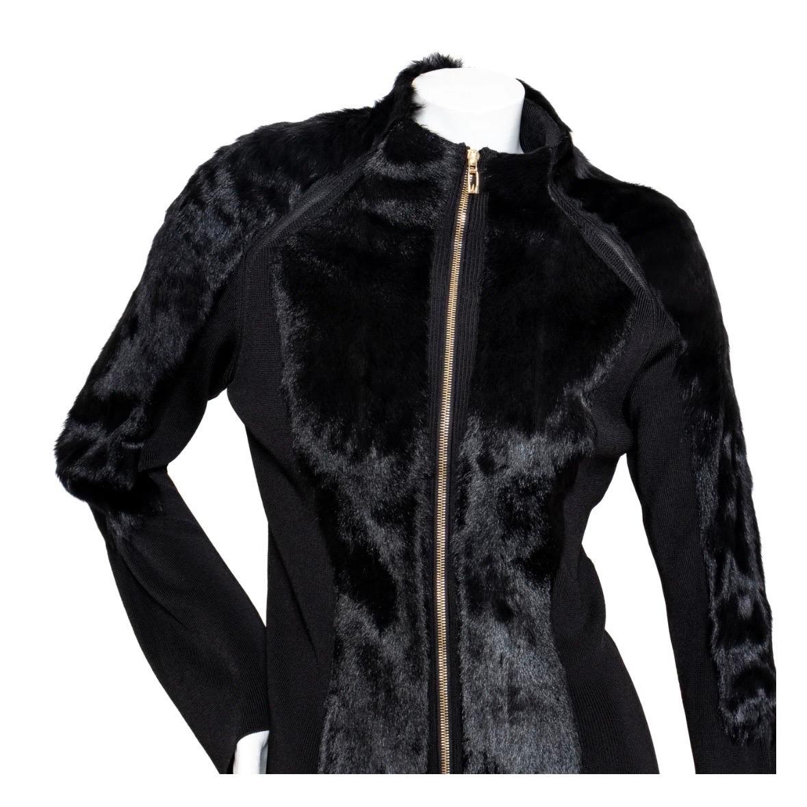 Knit and Fur Zippered Cardigan by Tom Ford for Gucci
Circa 1999
Solid Black
Long sleeves
High neck
Knit with fur trim on front, shoulders, and arms 
Bell cuffs 
Silver-tone front zipper closure with dual 