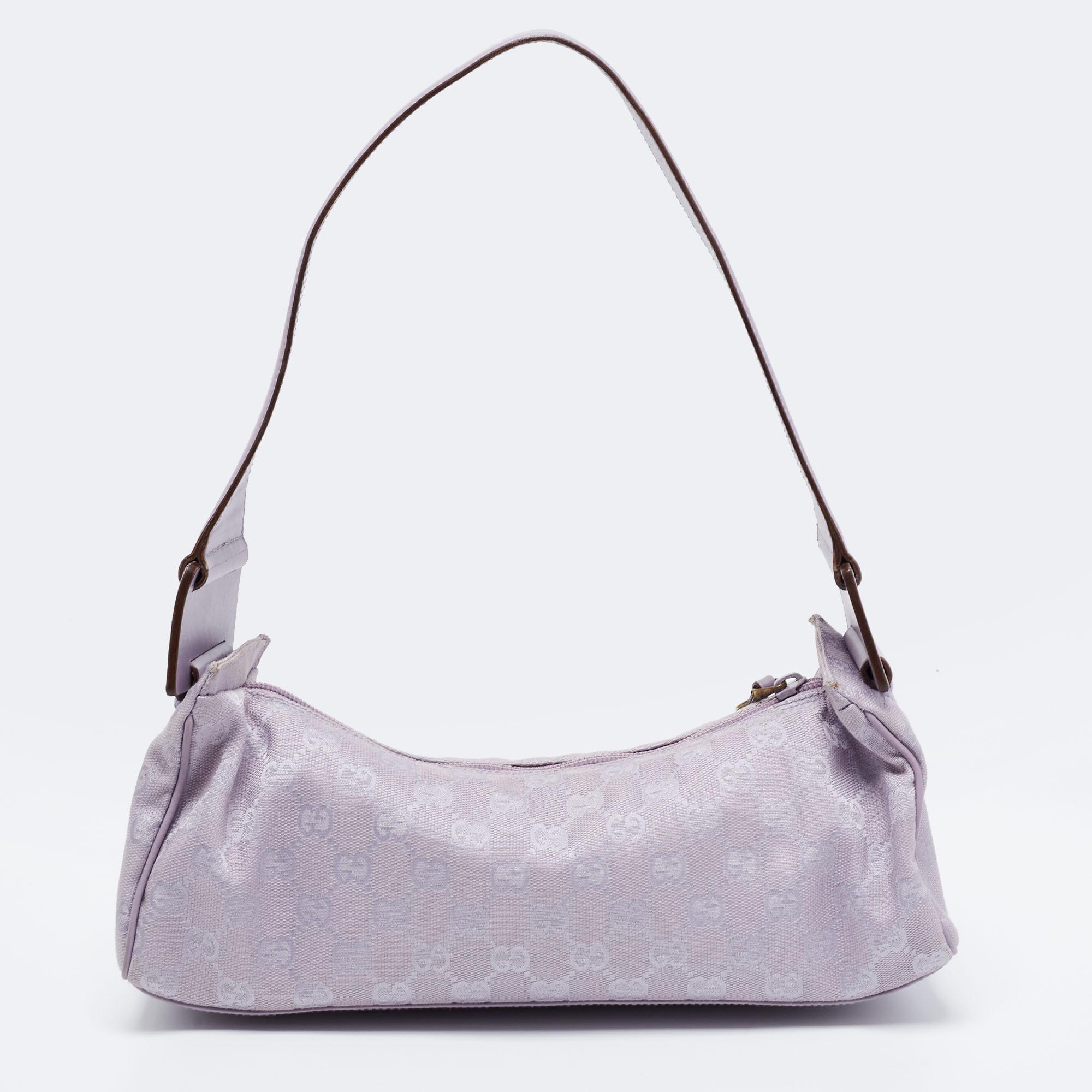 Crafted from GG canvas and leather in Italy, this hobo from Gucci features a single handle and a fabric interior perfectly sized to carry your essentials. The bag in lavender is lightweight, durable, and appealing.

