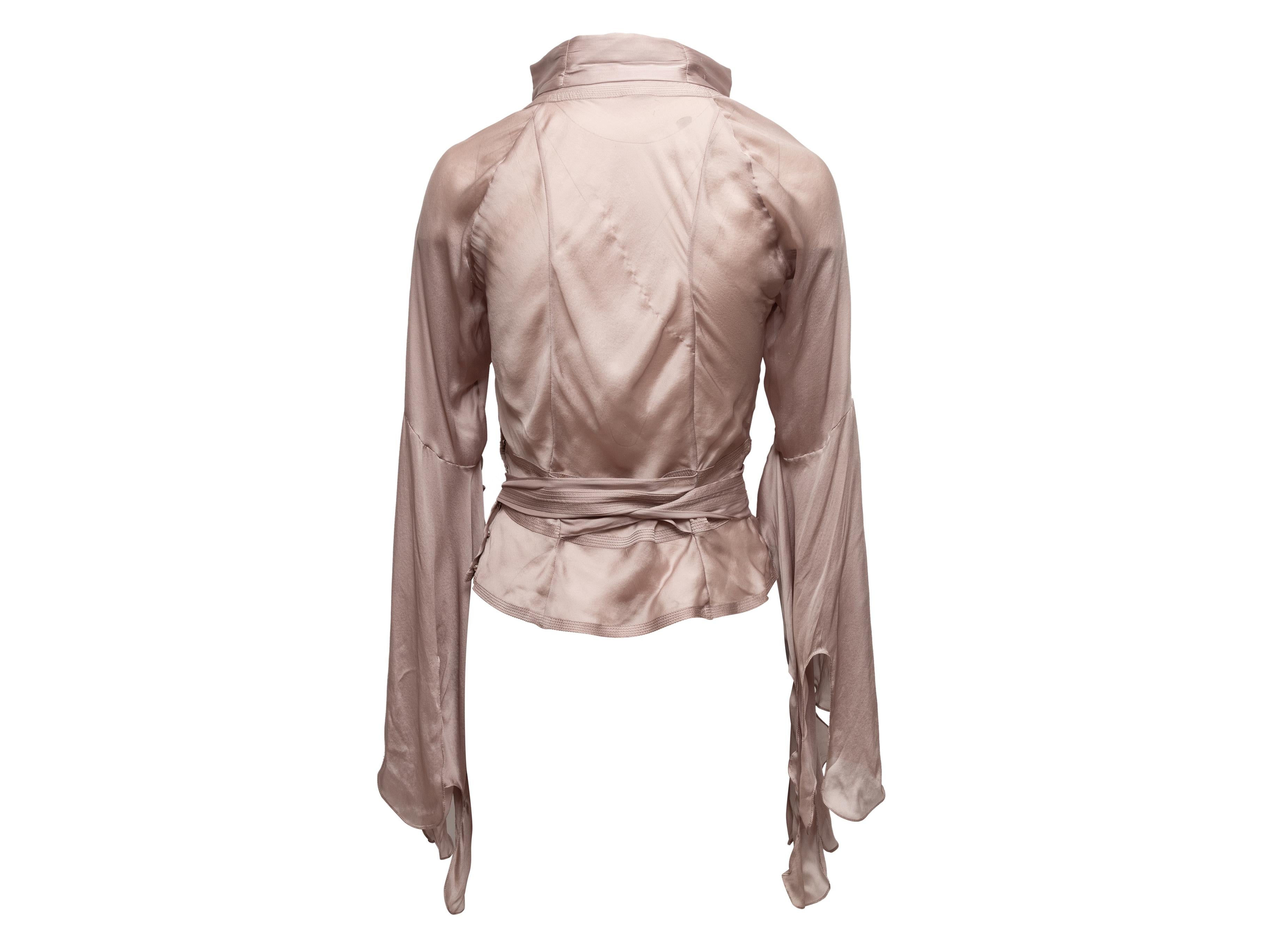 Product Details: Lavender silk blouse by Gucci. V-neck. Long bell sleeves. Sash tie at waist. 31