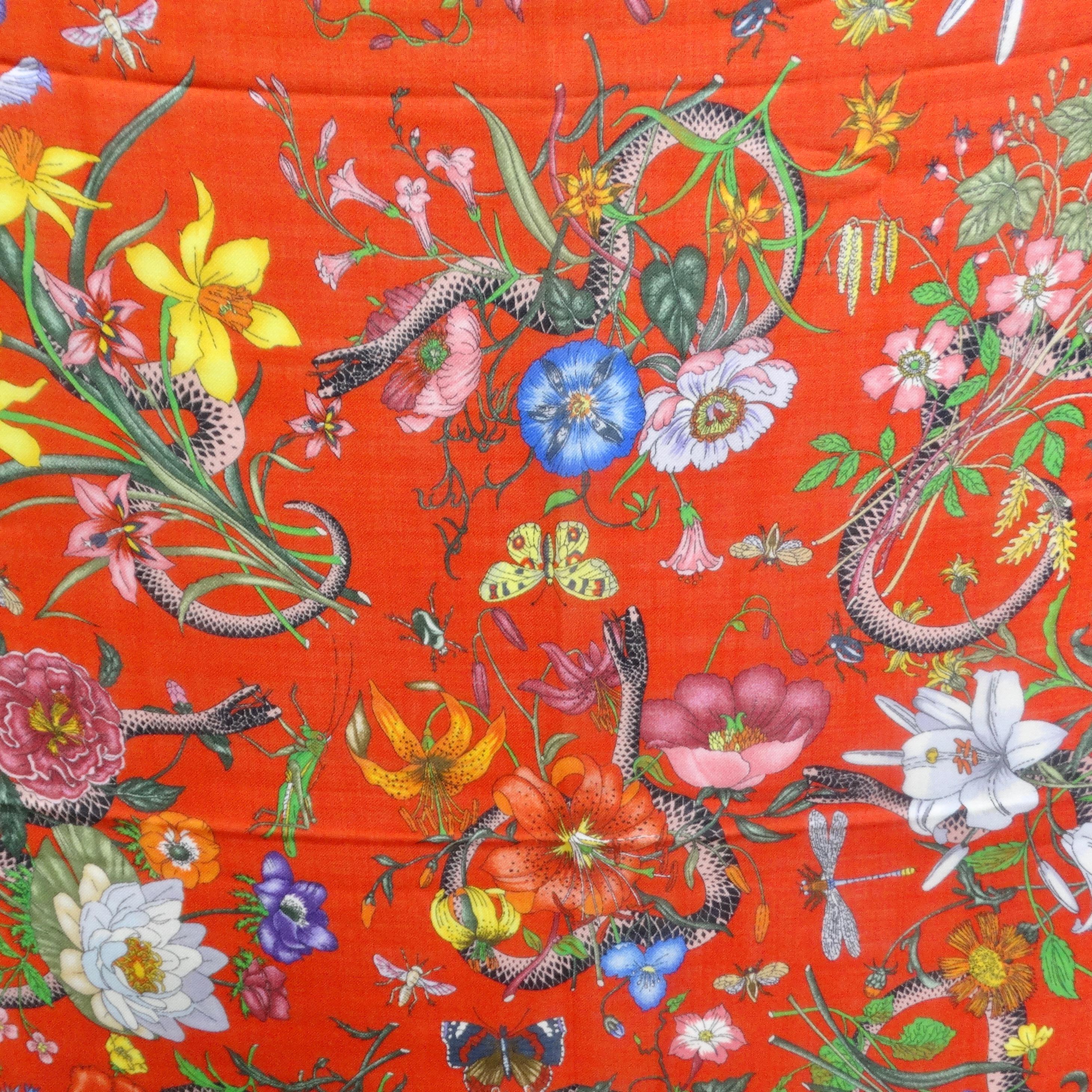 Indulge in the luxury of the Gucci L'aveugle Par Amour Flora Snake Scarf, a 2017 edition that is not just a scarf but a wearable masterpiece. This shawl scarf is a testament to Gucci's artistry, featuring a stunning array of flowers delicately