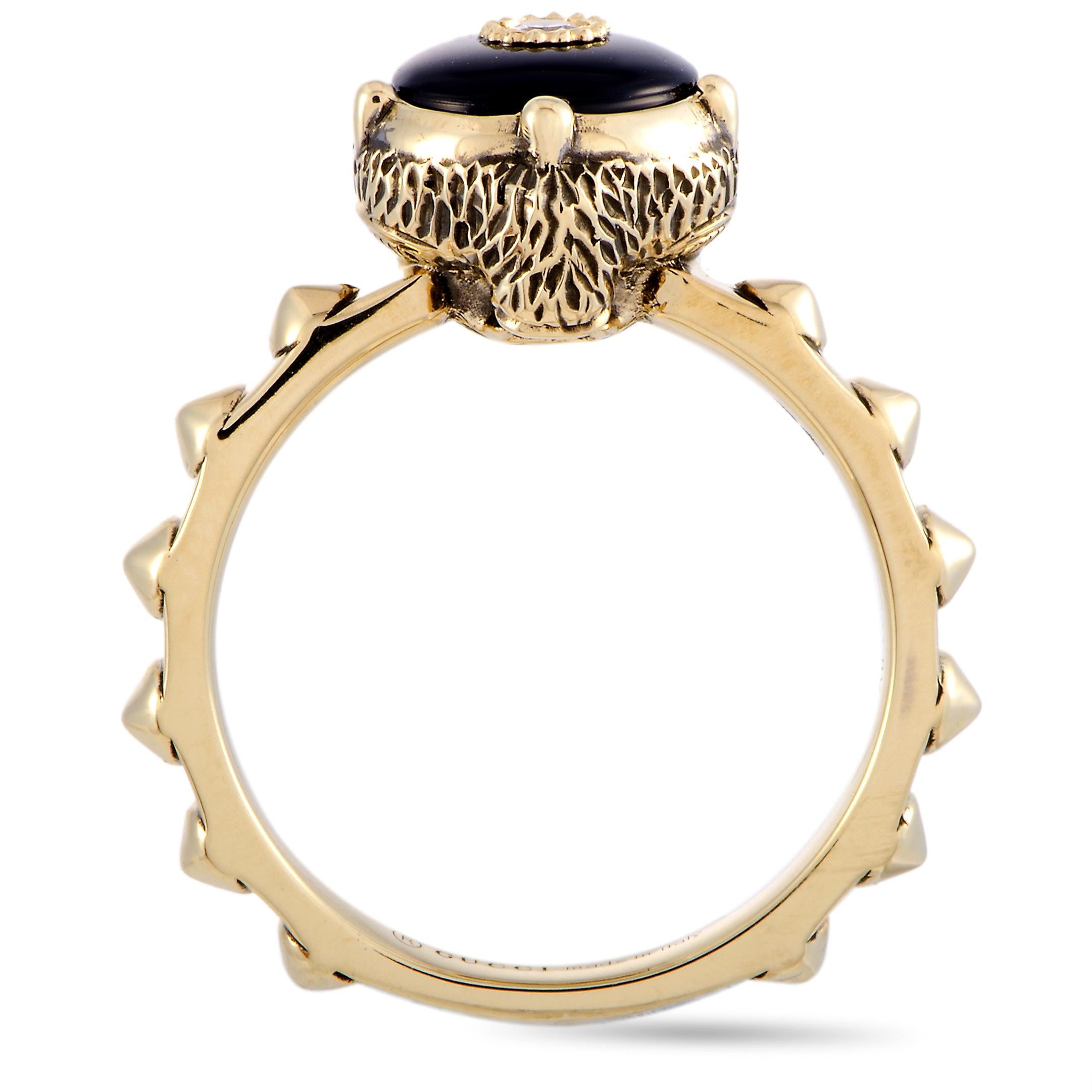 The “Le Marché des Merveilles” ring by Gucci is crafted from 18K yellow gold and set with an onyx and three diamond stones. The onyx weighs approximately 1.07 carats and the diamonds boast GH color and VVS clarity and amount to approximately 0.05