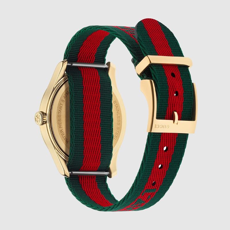 Yellow gold PVD case, green and red Web nylon dial with embroidered gold bee, green and red Web nylon strap with woven 