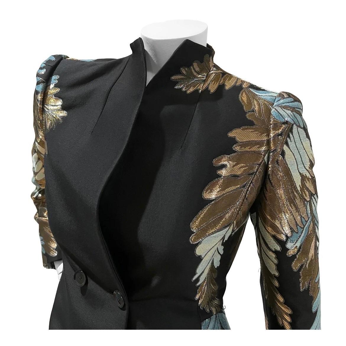 Gold Leaf Fitted Black Blazer by Gucci
Made in Italy 
Fall / Winter 2013
Black with gold and blue embellishment
Dual horizontal black Gucci button closure on front of blazer
Cuffs have four button detail
Fabric Composition; 35% Cotton, 20% Rayon,