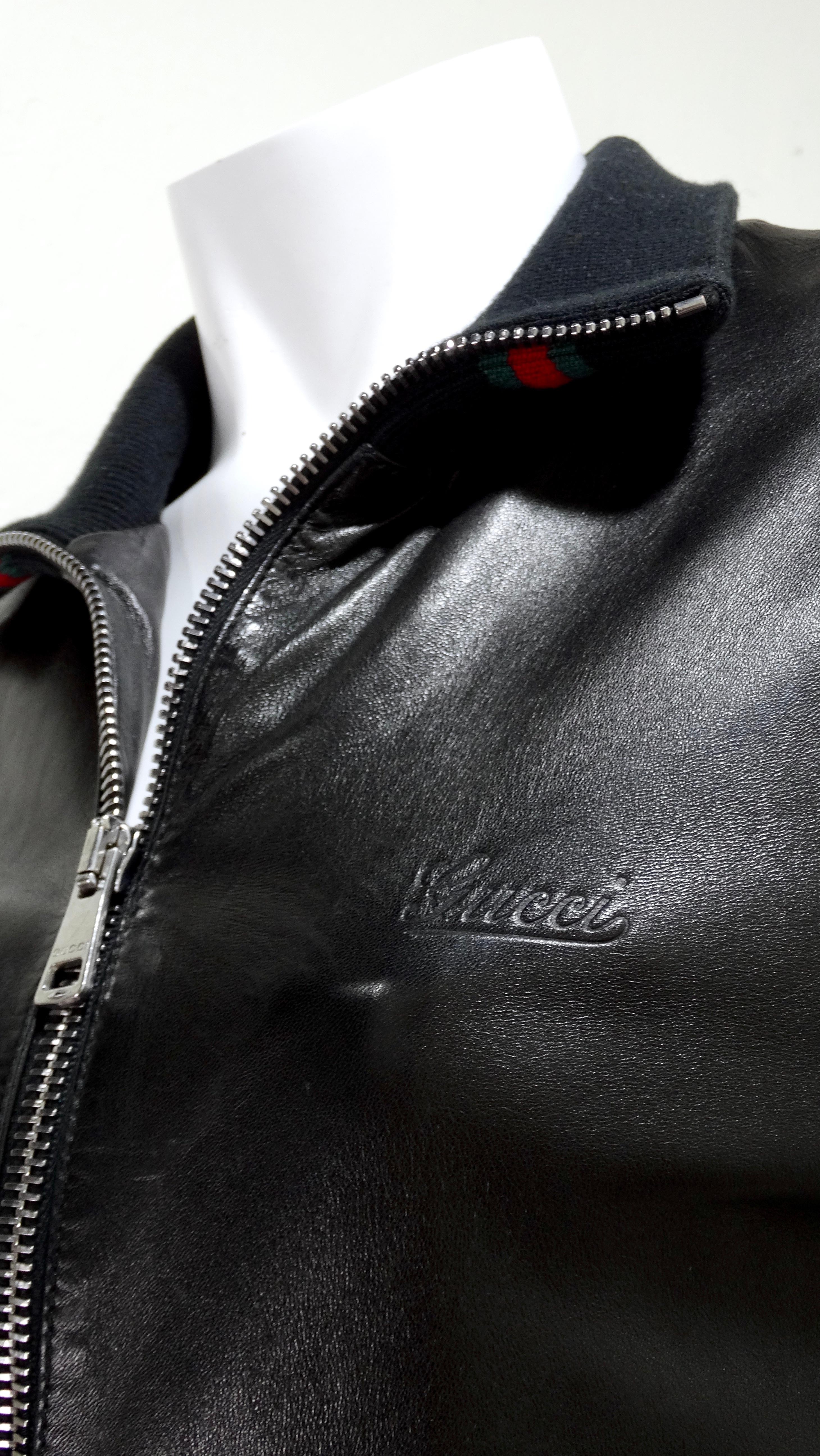 Feel cool when fall comes around with this amazing Gucci bomber jacket! Bombers are back and are here to stay! They make you feel effortlessly cool while keeping you warm. This jacket features a beautiful black leather, knit lining with black, red,