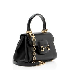 Borsa Gucci in pelle Horsebit 1955 Mini con manico superiore e catena