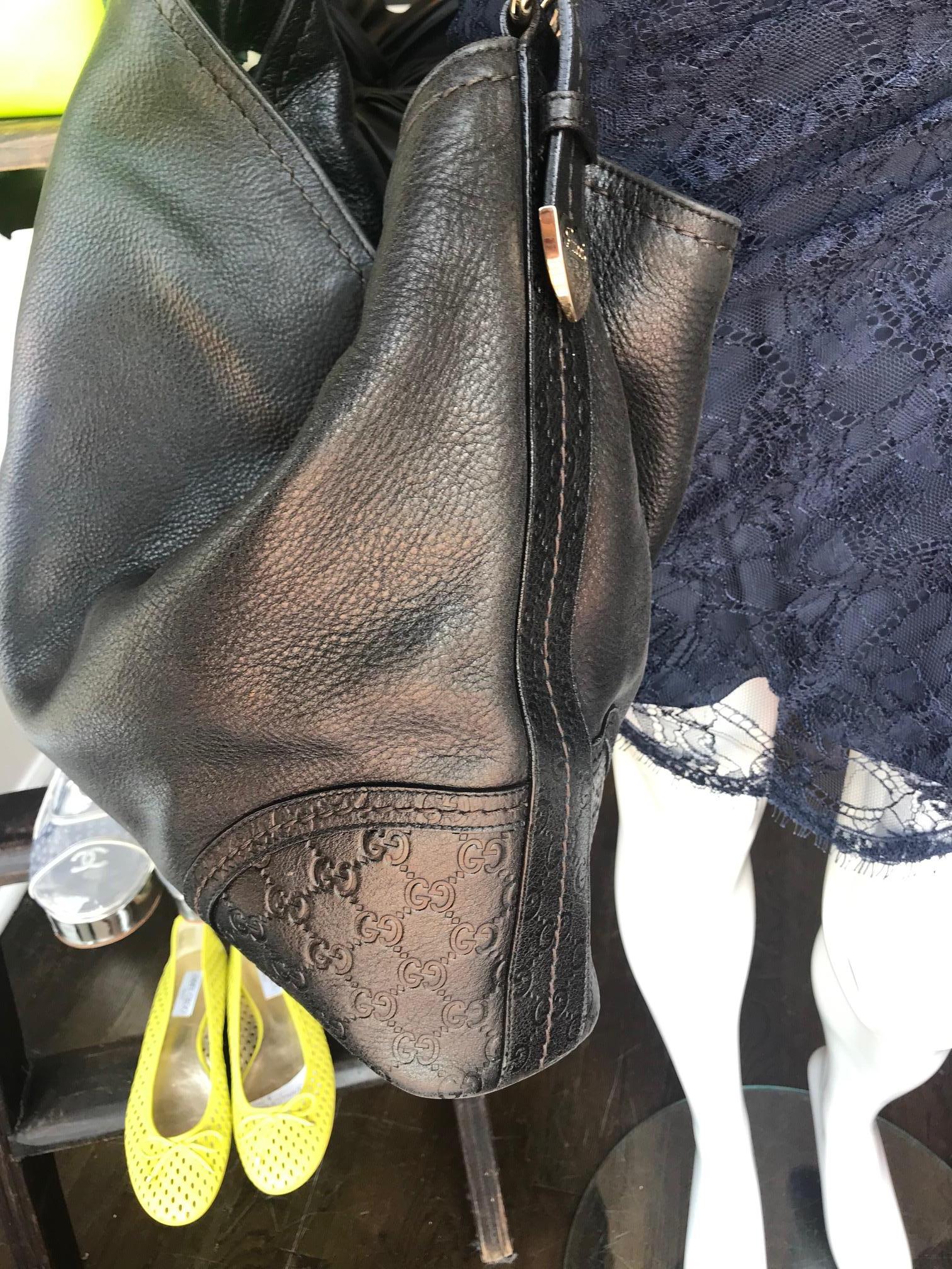 Women's or Men's Gucci leather Monogram Embossed Shoulder Bag For Sale