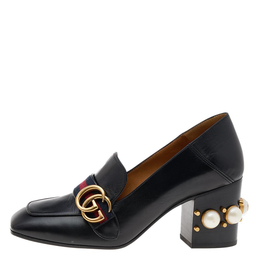 Advance your simple look with your choice of footwear. Choose creations as these Gucci loafer pumps that are made of leather and enhanced with embellishments on the block heels. The signature GG logo at the front brings in a fine finish.

Includes: