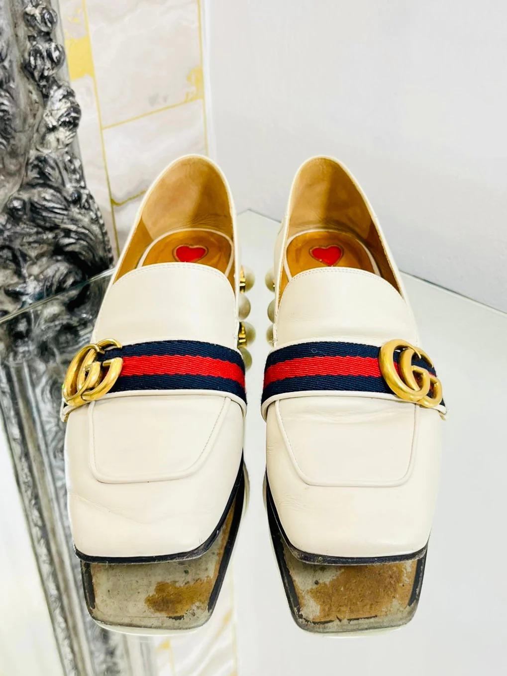 Gucci Leather & Pearl Loafer

Current season, 'GG' gold logo set on web strip. Midi heel with 'GG' logo pearls and studs. The back of the shoe can be worn up or down! Wear as  shoe or a mule!

Additional information:
Size – 36
Composition – Leather,