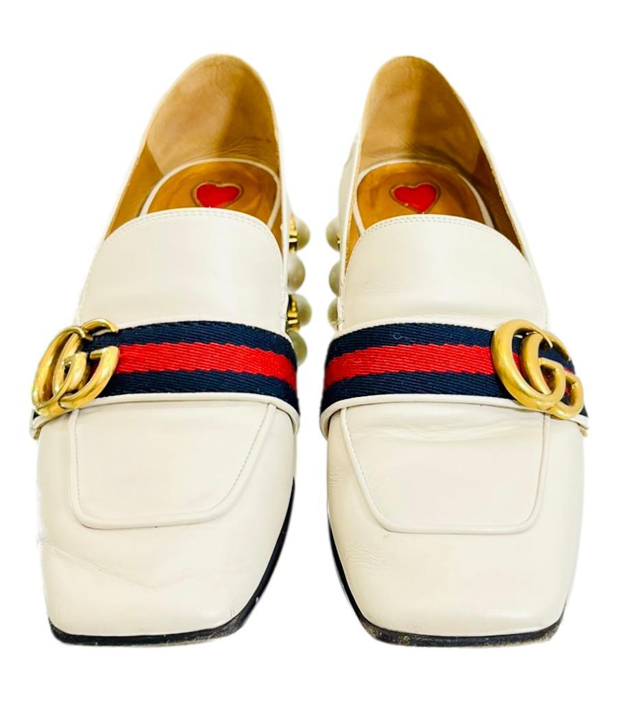 Gucci Leather & Pearl Loafer
Current season, 'GG' gold logo set on web strip.
Midi heel with 'GG' logo pearls and studs. The back  of the shoe can be worn up or down! Wear as  shoe or a mule! Rrp £805.
Size - 36
Condition - Good/Very Good (Some