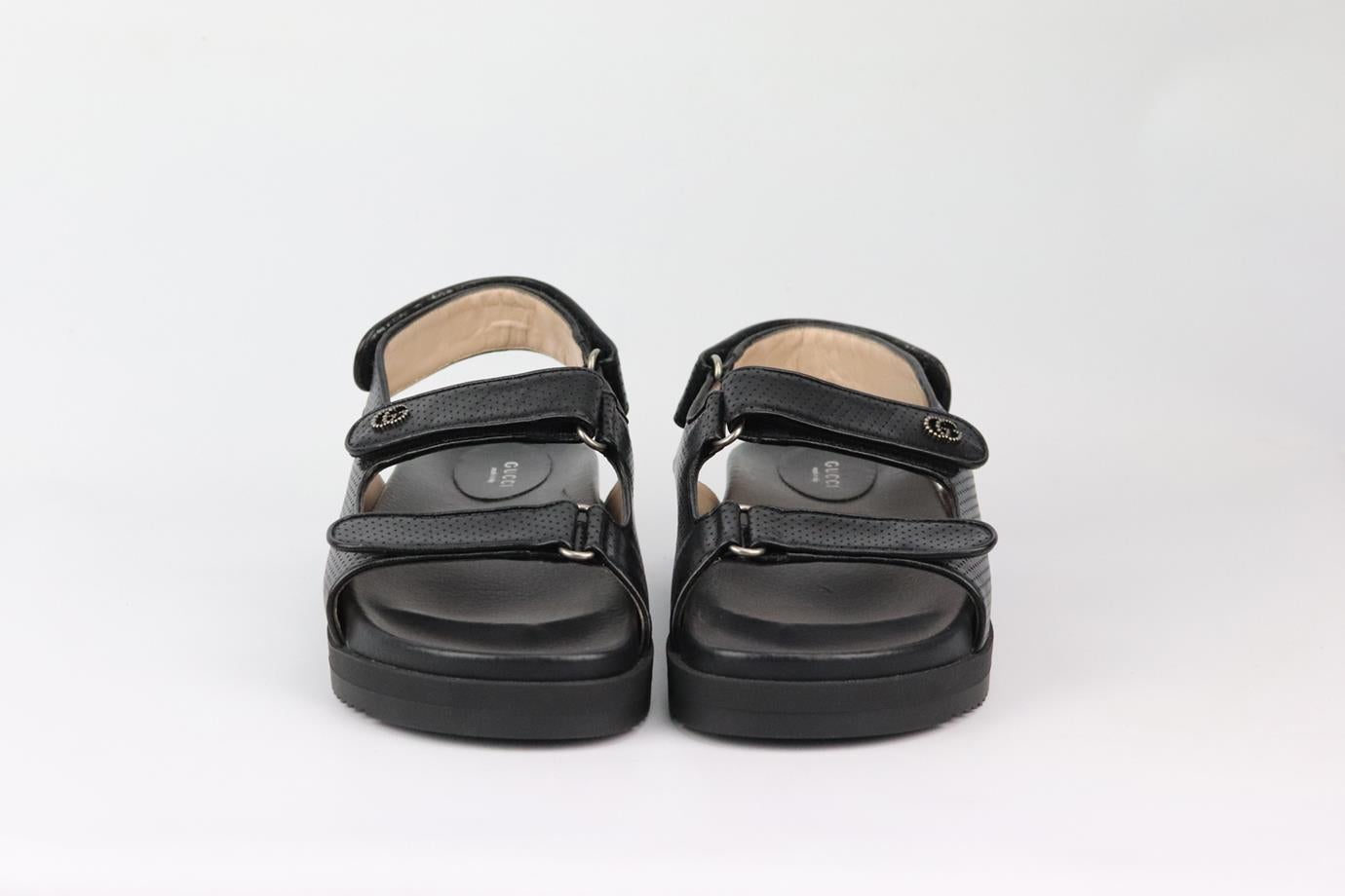 These ‘Dad’ sandals by Gucci have been made in Italy from glossy black perforated leather that's detailed with the label's emblem and have comfortable molded footbeds, the soles are gripped and chunky. Platform sole measures approximately 50 mm/ 2