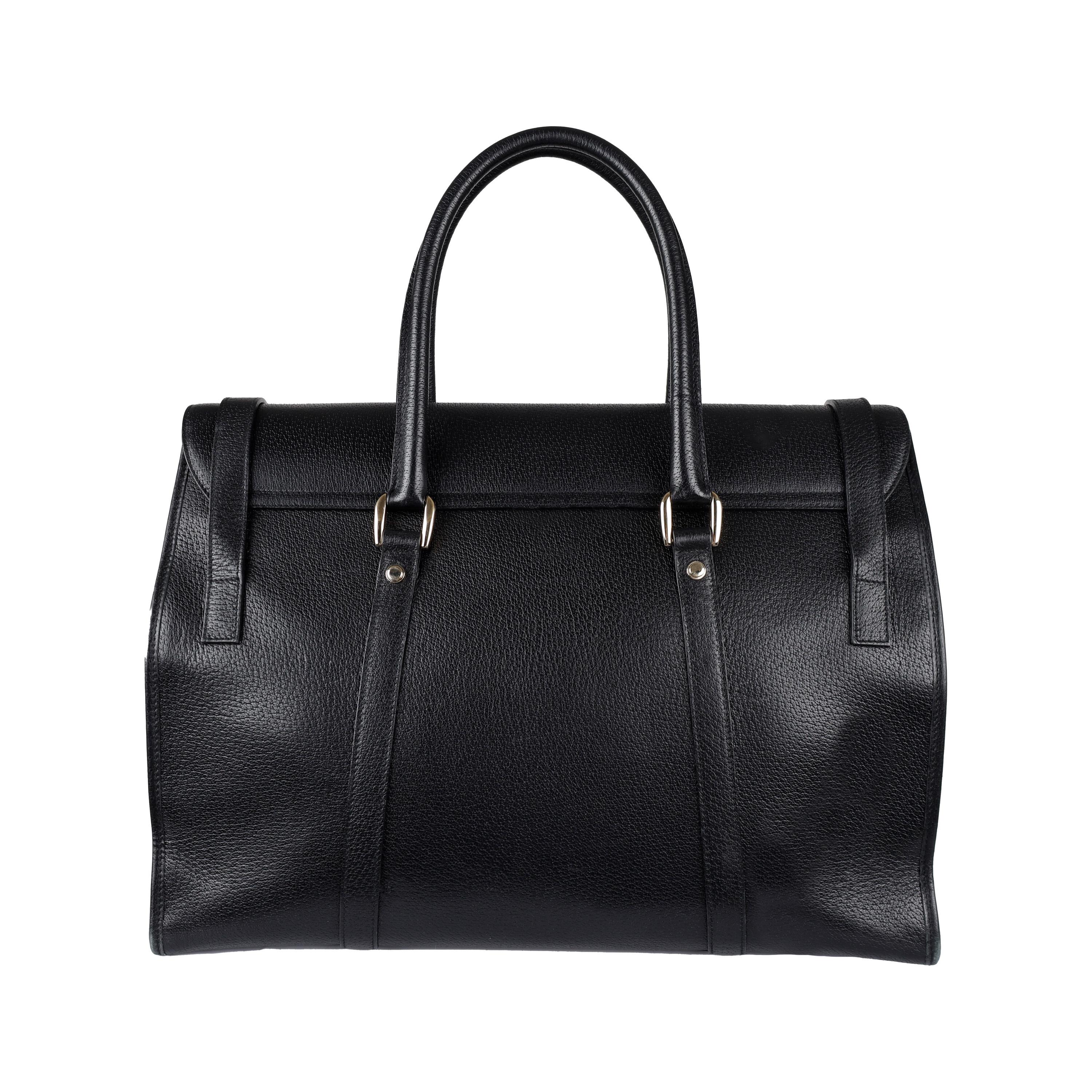 This Gucci Black Leather Satchel Bag is the perfect combination of style and function. Crafted from genuine leather, it sports a sleek black design, dual buckle closures, and a large interior pocket offering plenty of space for your belongings.