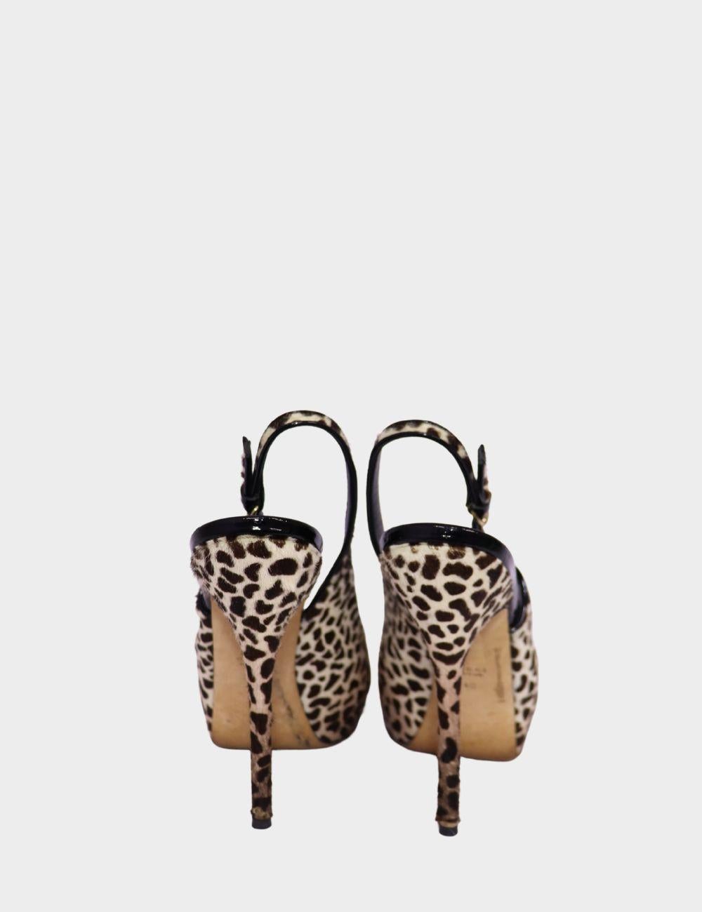 Make a fierce fashion statement with these Gucci leopard print slingback heels. Crafted from luxurious pony hair leather, these peep toe platform heels feature an adjustable slingback strap for a secure fit and a sky-high stiletto heel that exudes
