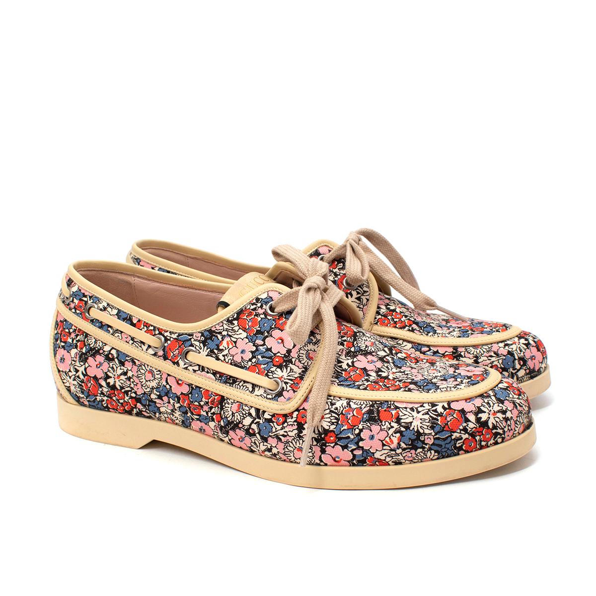  Gucci Liberty Floral Deck Shoes
 

 - Part of a 2020 collaboration between the Italian house and Iconic London shop, known for their printed fabrics
 - Small ditzy floral in tones of red, pink, blue & ivory, contrasted with a cream rubber sole, and