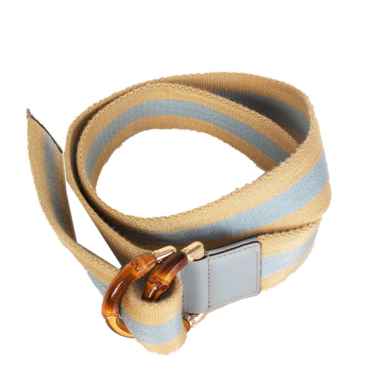100% authentic Gucci web belt in light gold and light blue cotton blend featuring brown bamboo crest slip lock buckle. Has been worn and is in excellent condition. 

Tag Size 90
Width 4cm (1.6in)
Length 111cm (43.3in)
Buckle Size Height 6cm
