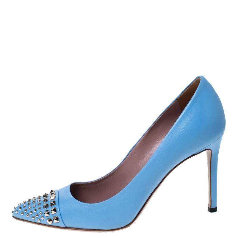 If you wonder what style really looks like then take a look at these beautiful light blue Coline pumps from Gucci. These intricately designed leather pumps have metal studs on the pointed cap toes. The pumps are made in Italy and are complete with