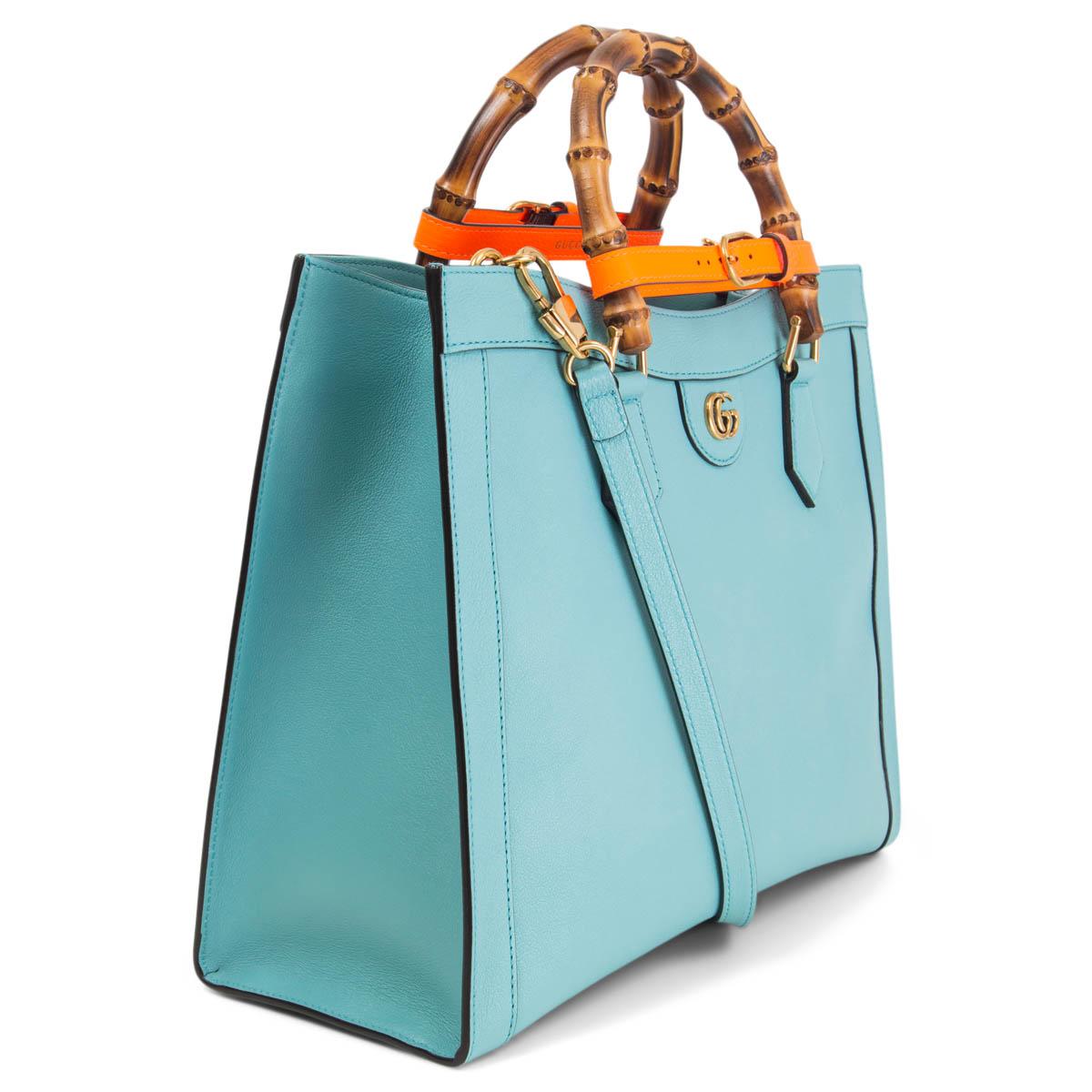 100% authentic Gucci Diana Medium Tote Bag in light blue calfskin, combining recognizable elements of the House, the small tote bag is defined by its bamboo handles and gold-tone Double G hardware. The bag is further accentuated by two orange neon