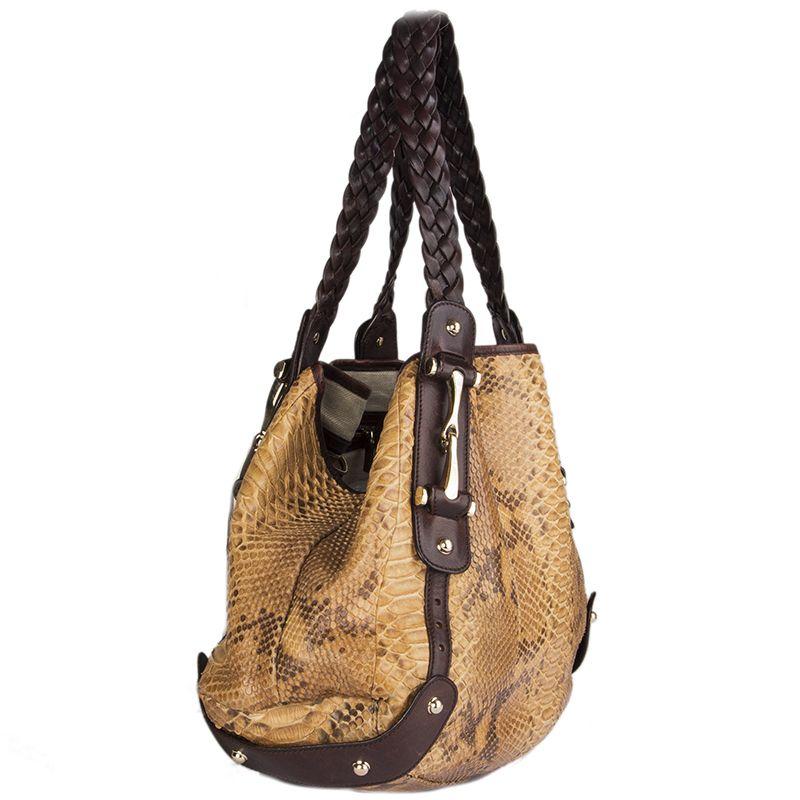 Gucci 'Pelham' horsebit shoulder bag made from light to medium brown python with dark brown leather braided handles. Lined in beige canvas (with some very faint pen mark stains) with a zipper pocket against the back. Has been carried with very soft