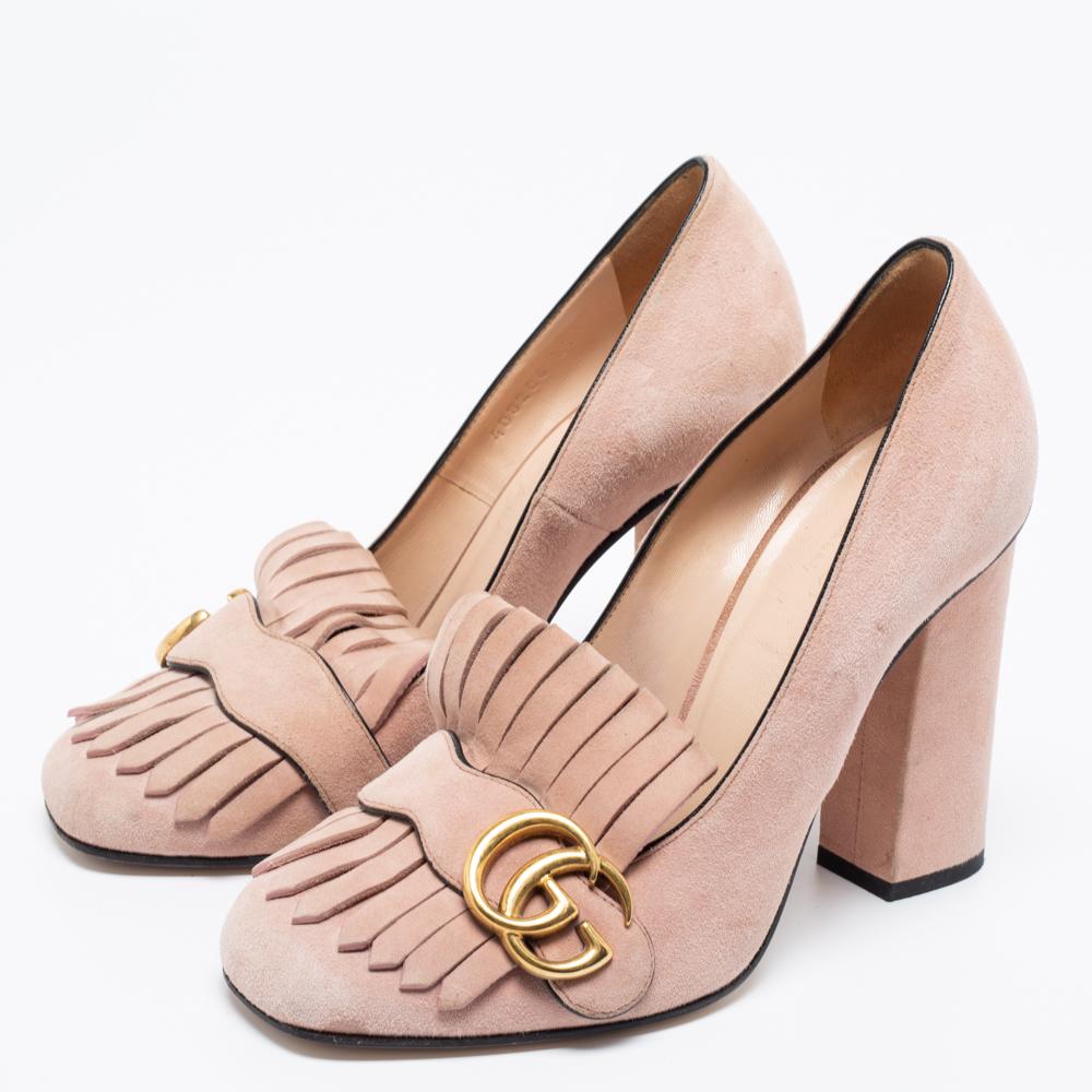 This pair of pumps by Gucci is a buy to wear and treasure. They've been crafted from suede and styled with folded fringes with the brand's signature GG on the uppers. Squarish toes and a set of block heels complete the pair.