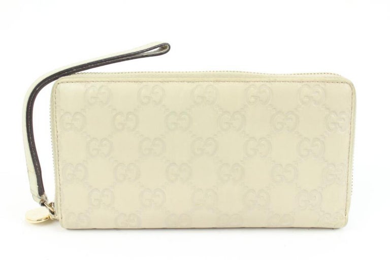 Gucci Light Taupe Beige Guccissima Zip Around Heart Wallet 75g418s at  1stDibs | gucci heart wallet, gucci date code, gucci σημα