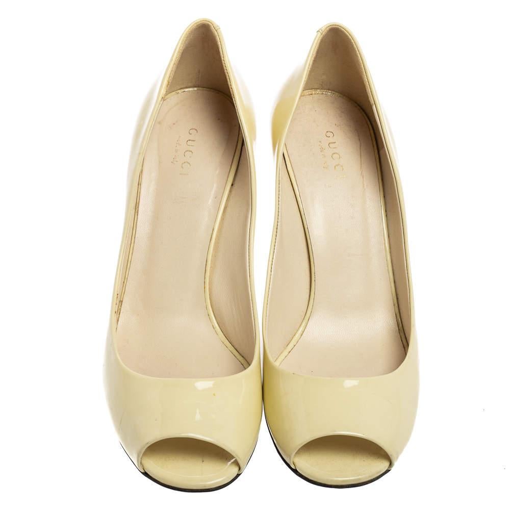 There are some shoes that stand the test of time and fashion cycles, these timeless Gucci pumps are the one. Crafted from patent leather in a light yellow shade, they are designed with sleek cuts, peep-toes, and sturdy heels.

Includes: Original