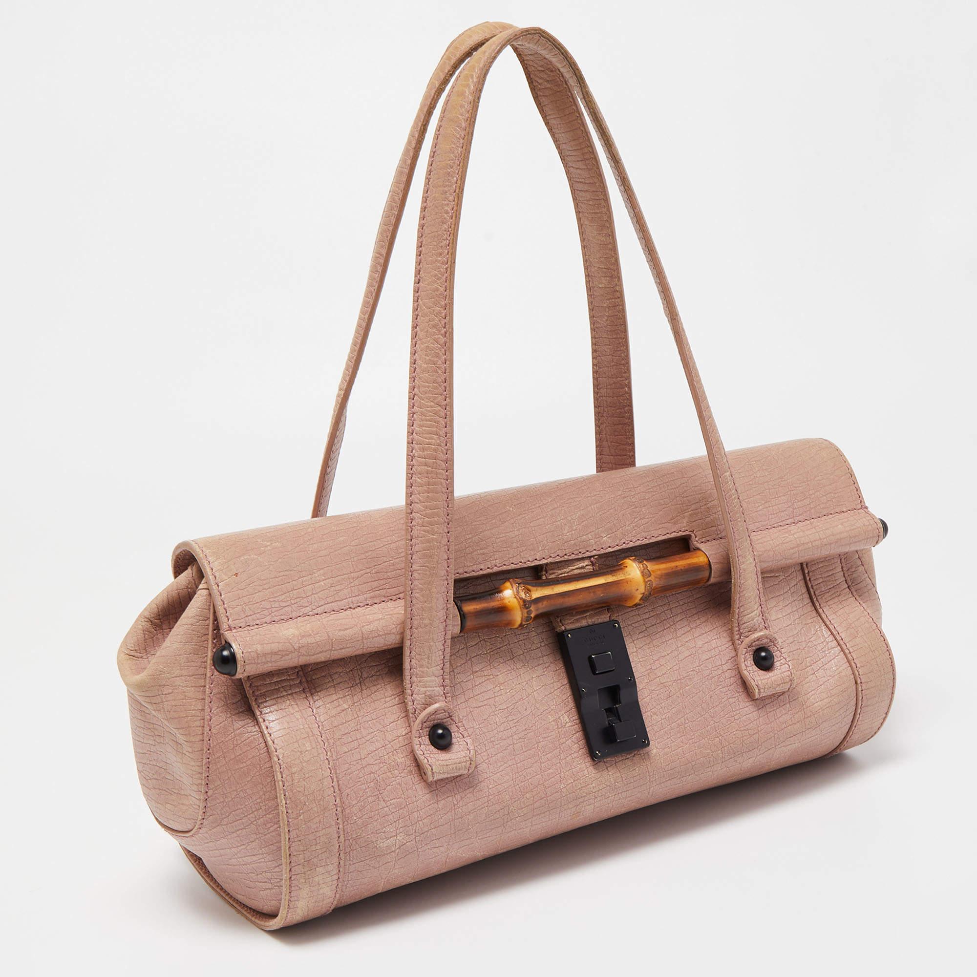 Stylish and easy to carry, this designer satchel will be a fine choice for work or after. Lined well, this pre-loved bag for women can easily fit all your essentials. It can be held in your arm or hand.

