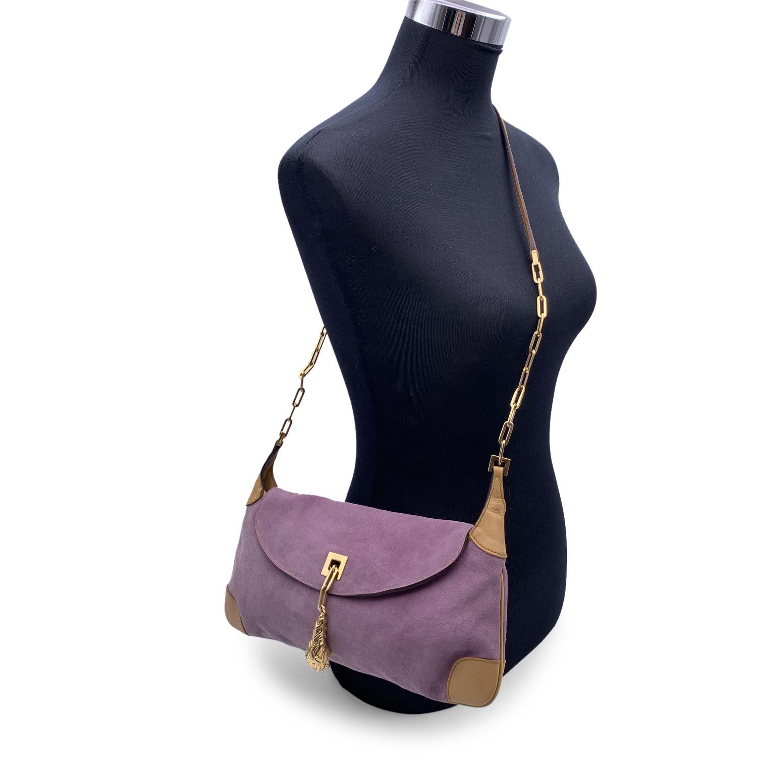 Beautiful Gucci lilac suede and beige leather shoulder bag, designed by Tom Ford. Gold metal tiger head pendant on the front. Gold metal and leather shoulder strap. Beige fabric lining. 1 side zip pocket inside. Horsebit detailing on the sides.