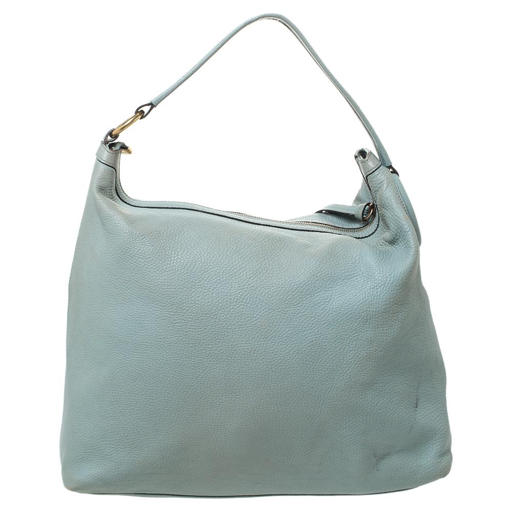 Twill hobo from the house of Gucci, one of the most coveted luxury brands, is a pleasant choice for any fashion lover. Designed in smooth, lime green leather, this bag comes with a single handle. The exterior of the bag features an interesting GG