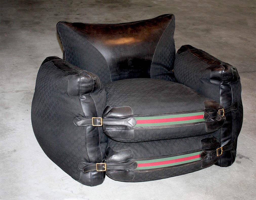 Gucci limited edition armchair black leather, monogram canvas fabric. Made in Italy, circa 1988.

Gucci limited edition black leather and monogram canvas fabric with red and green stripe armchair.