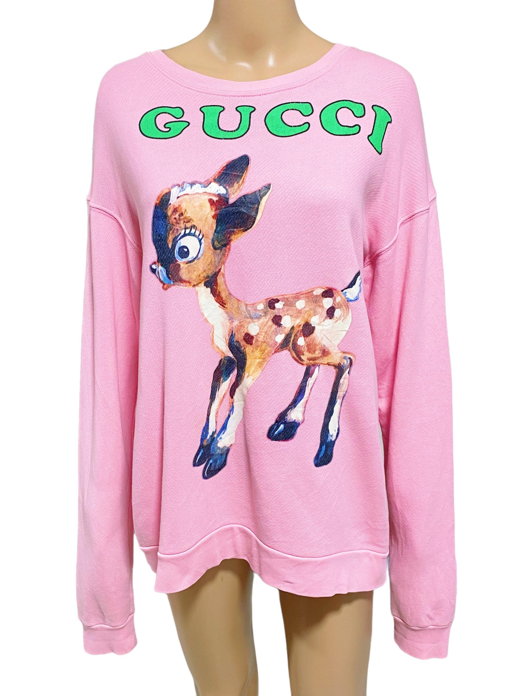 Special edition collectible item! The Gucci logo and a fawn are printed on the front of this oversized
sweatshirt. The ladybug and flower print is a subtly humorous addition that connects to the House story. Color is light pink, a thick jersey made