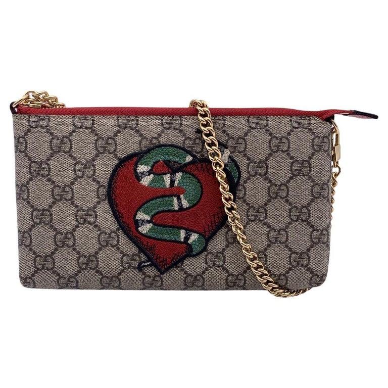 Gucci Limited Edition GG Supreme Kingsnake Heart Pochette Bag at 1stDibs