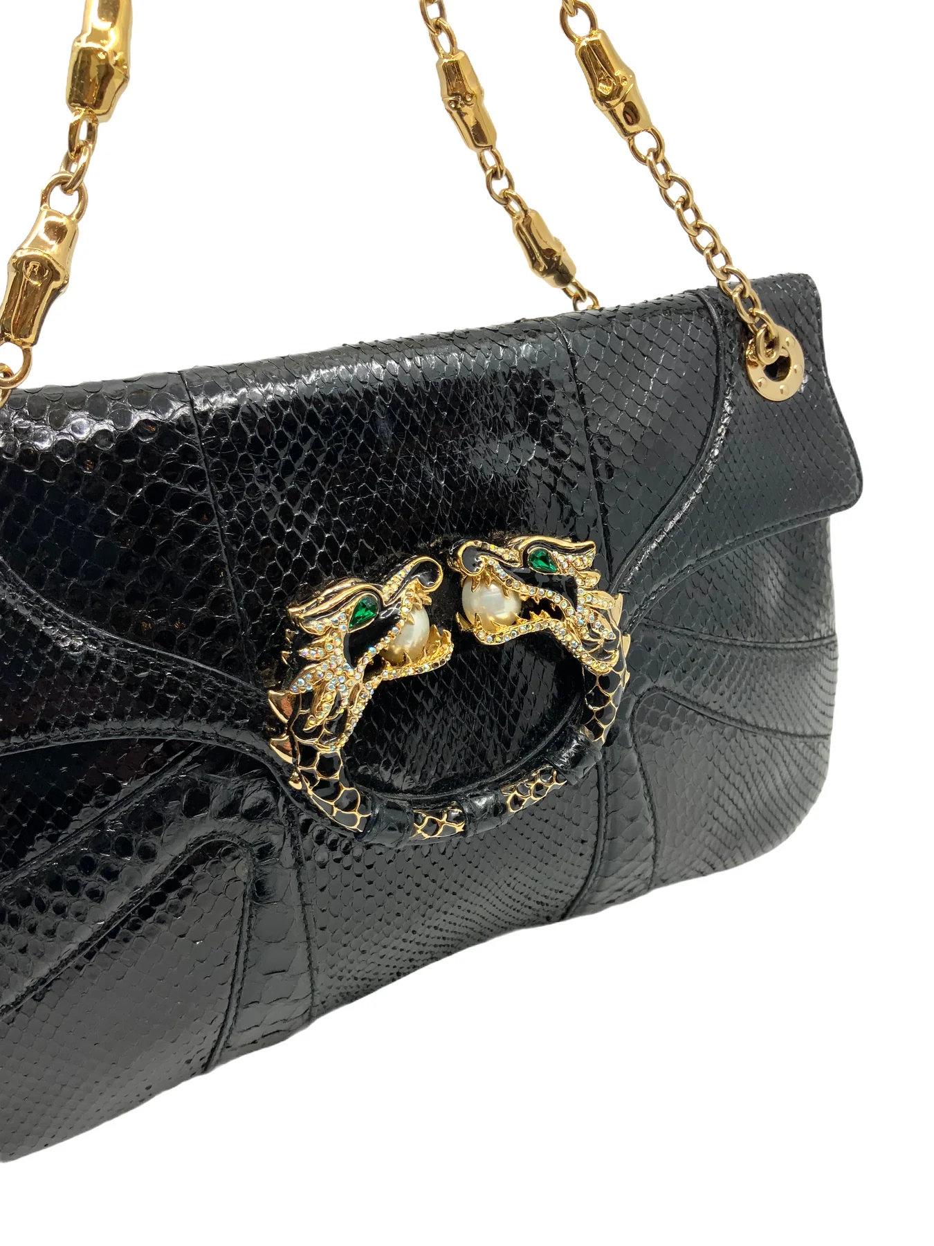 Gucci Limited Edition Tom Ford for Gucci
Leather Jeweled Dragon Bag featuring gold-tone chain link shoulder straps and a crystal-embellished double headed dragon on the flap.
Black snakeskin 
Double chain link straps, 7