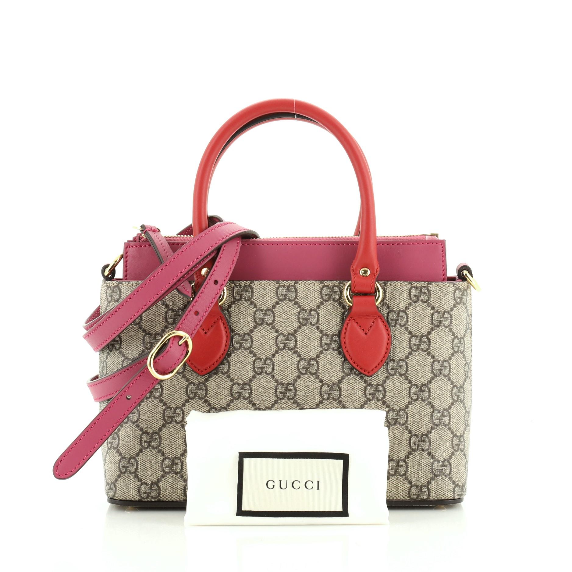 This Gucci Linea A Convertible Tote GG Coated Canvas Mini, crafted in neutral GG coated canvas, features dual rolled leather handles, protective base studs, and gold-tone hardware. Its zip closure opens to a neutral microfiber interior with slip