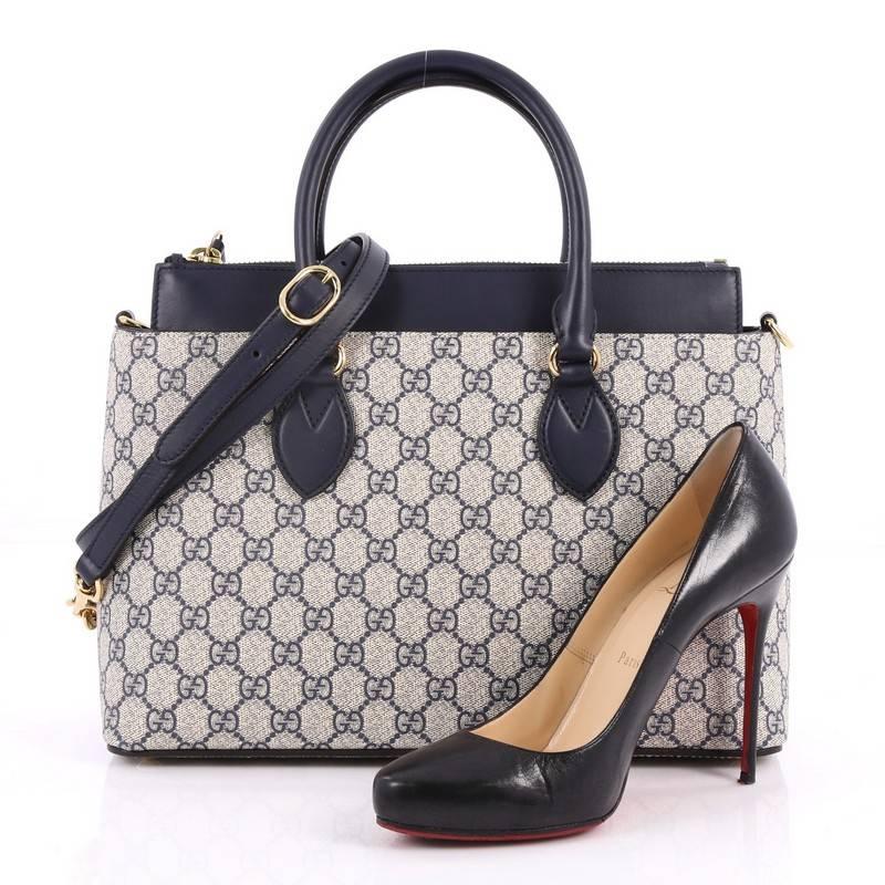 This authentic Gucci Linea A Convertible Tote GG Coated Canvas Small is an elegant bag perfect for everyday casual looks. Crafted in blue GG coated canvas with blue leather trims, this totes features dual-rolled leather handles, detachable strap,