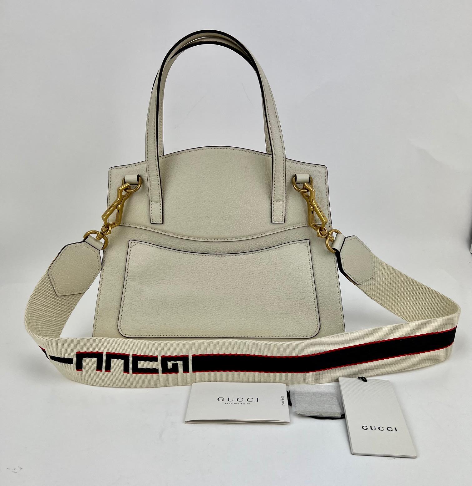 Pre-Owned  100% Authentic
GUCCI Linea Medium Totem Web Stripped
Yellow Butterfly Top Handle Bag
RATING: A...excellent, near mint, only
slight signs of wear
MATERIAL: grained calfskin, canvas
STRAP: Gucci Canvas removable
Strap: 39'' long
DROP: