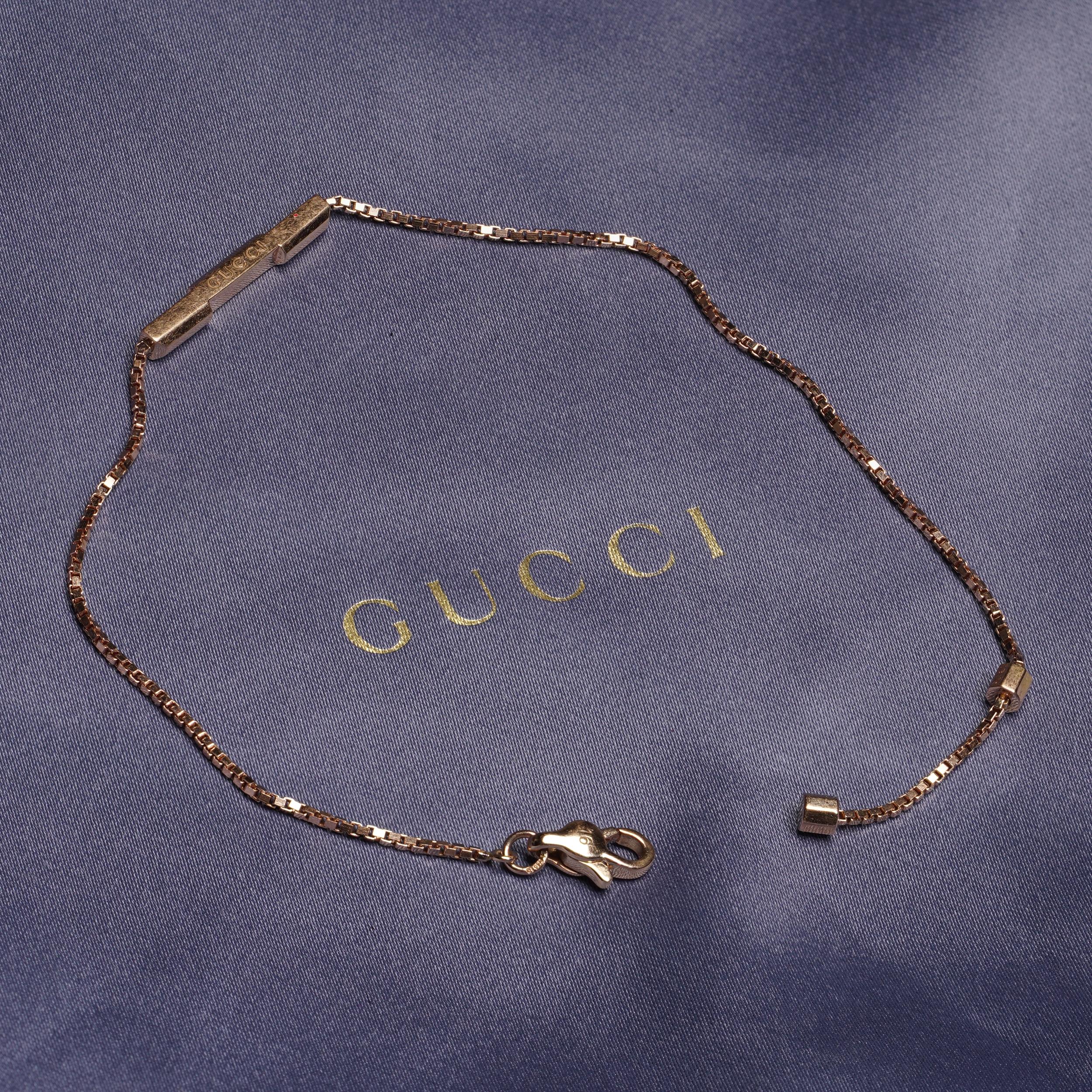 From Gucci’s Link to Love collection—a modern exploration of romance and identity—this elegant bracelet is crafted in 18 karat rose gold and features a minimalist bar pendant engraved with the iconic Gucci logo. Designed with clean lines and a