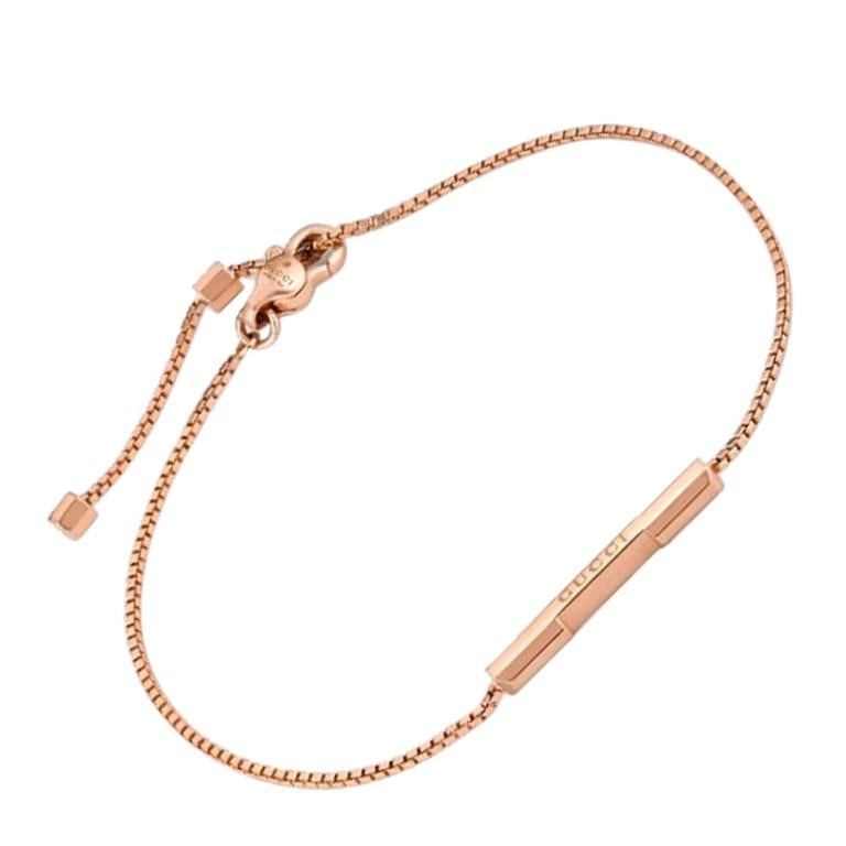 Bracelet à maillons Gucci avec barre « Gucci » en or rose YBA662106002 en vente