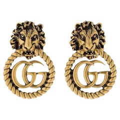 Gucci Lion Head GG Antiqued Gold Clip-on Earrings