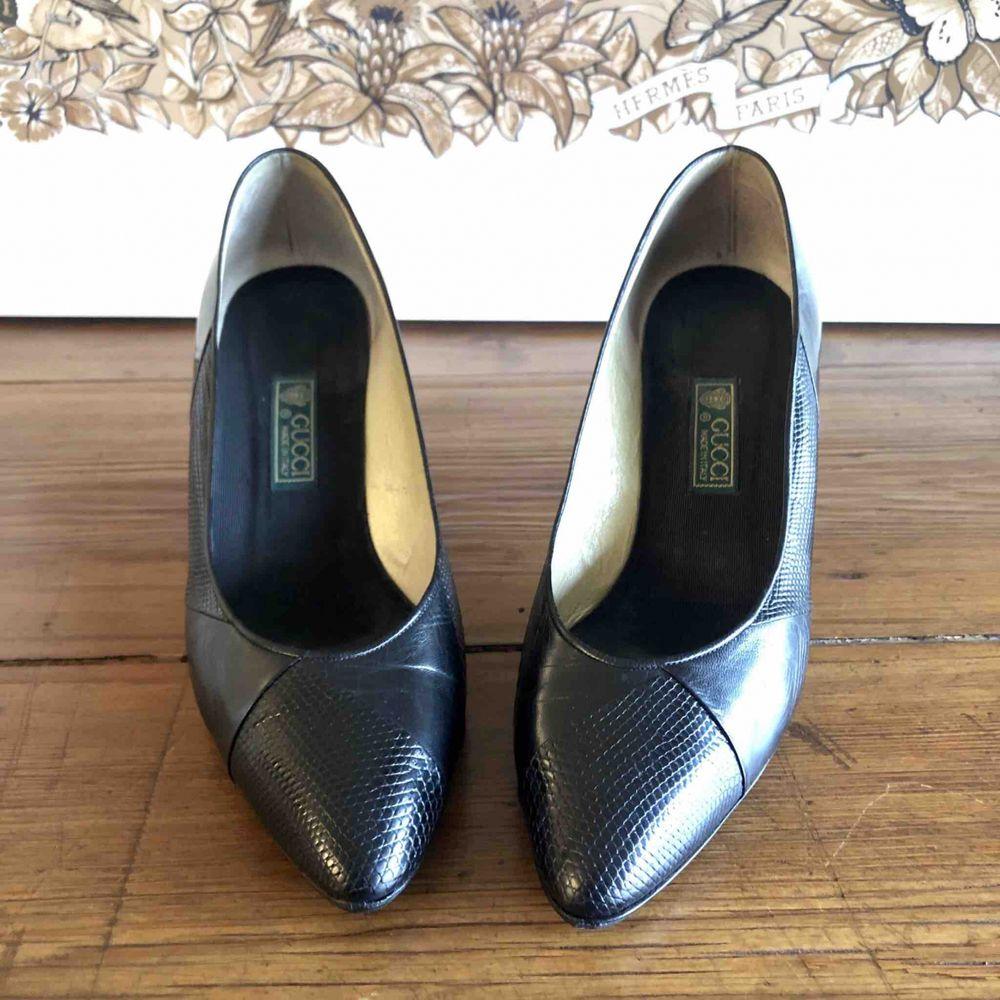 Gucci Lizard Leather Heels in Black

Super vintage Gucci shoes in black lizard and leather. 
Size 37, 8 cm heel and 24 cm insole. 
The sole has been resoled. 
They show some small signs of use but still in excellent condition. 

General